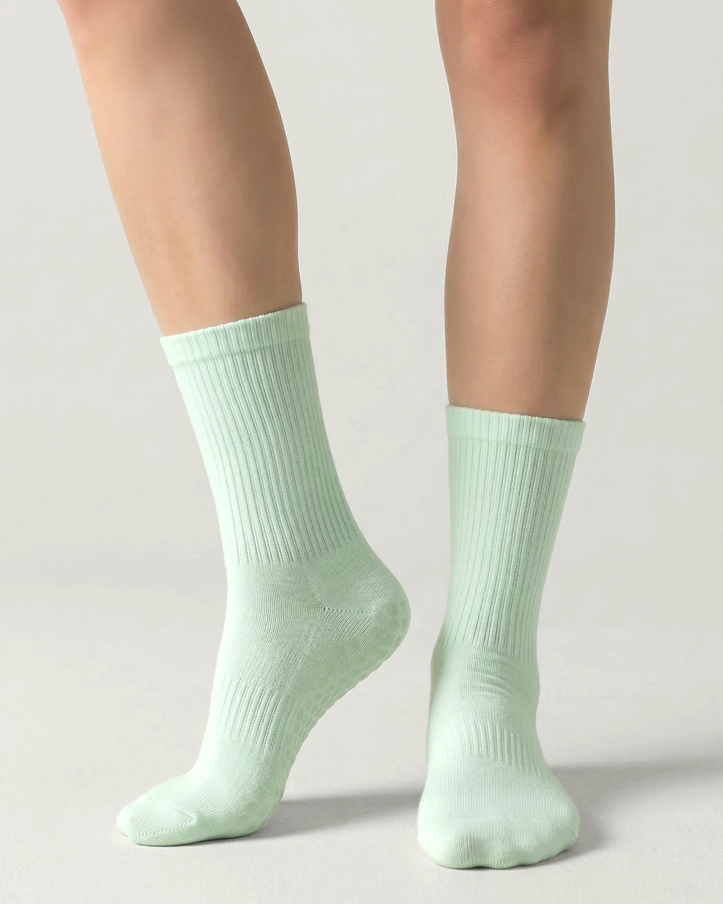 green | 04 | Green crew grip socks front angled view showing ribbed texture and crew height
