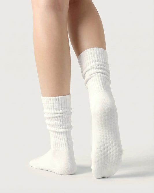 white | 02 | White slouch grip socks back side view showing slouch shape, grip sole detail, and soft ribbed texture
