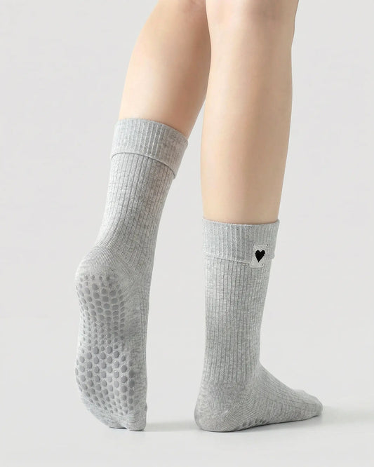 light-grey | 02 | Light-grey heart detail crew grip socks back side view showing grip sole detail, fold-over cuff, and black heart embroidery