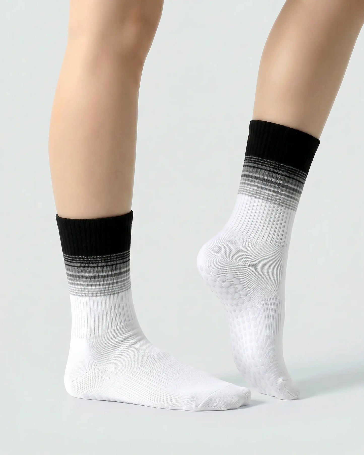 black-white | 03 | Crew grip socks side standing view showing  black and white contrast stripes, cream base, and refined studio silhouette