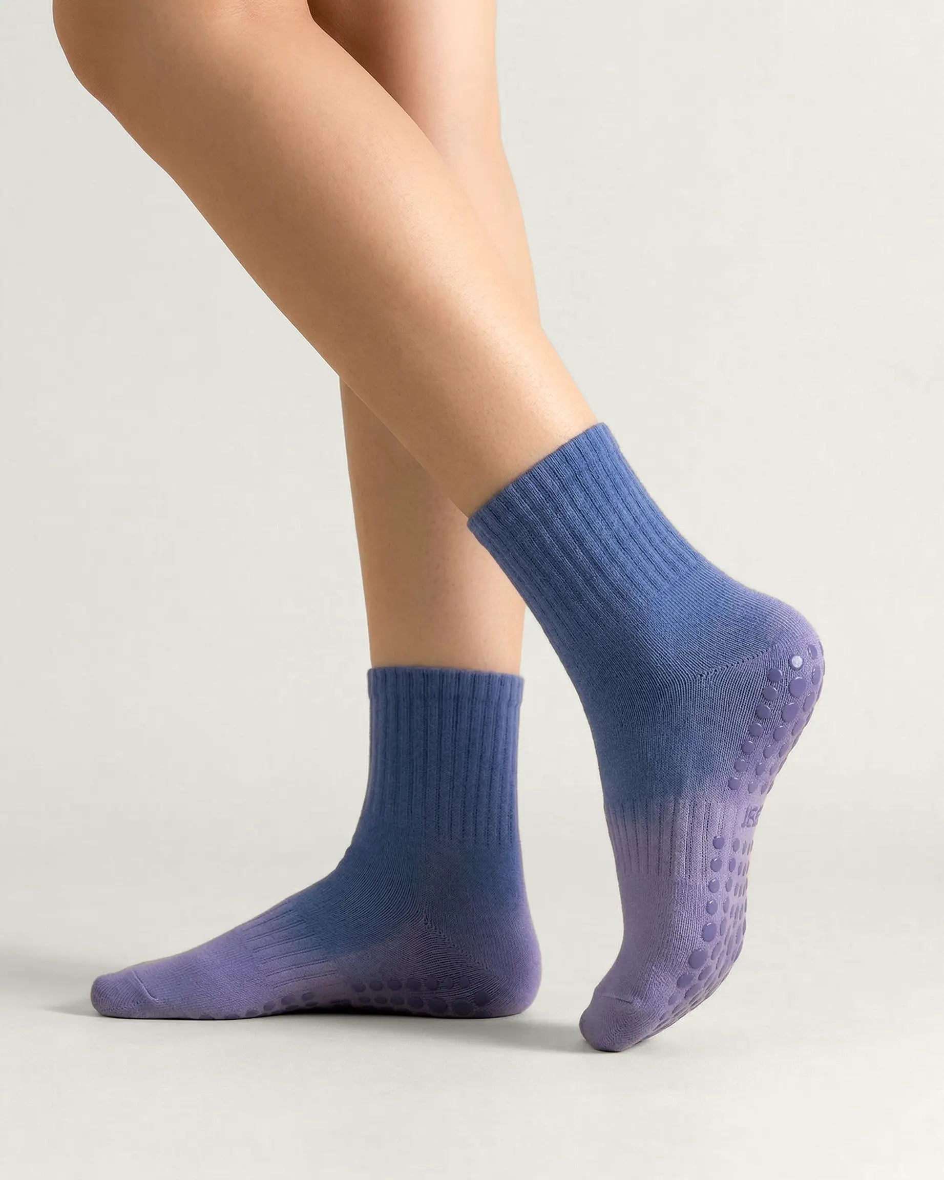 blue-purple | 01 | Blue purple gradient mid-crew grip socks side standing view showing soft knit texture, gradient ombré transition, and sole grip detail