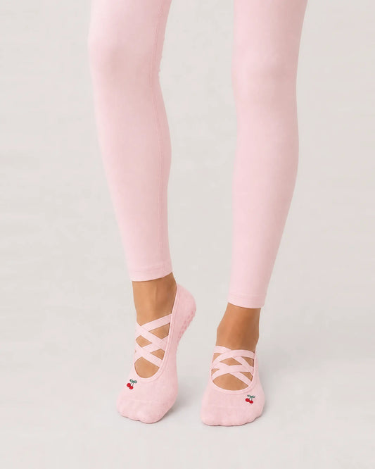 blush-pink | 01 | Blush pink Color-Pop Low-Cut Grip Socks front angled standing view showing the open-instep crisscross straps, low-cut fit, and mini embroidery detail