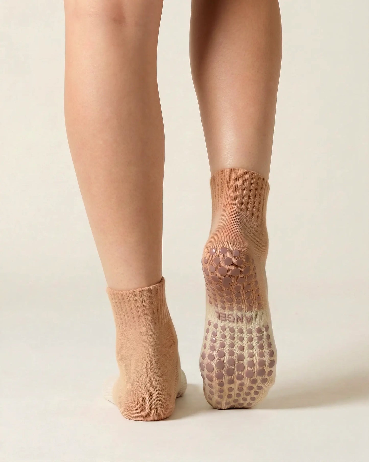 camel | 02 | Camel gradient mid-crew grip socks back standing view showing heel-to-cuff gradient fade, ribbed structure, and full sole grip coverage