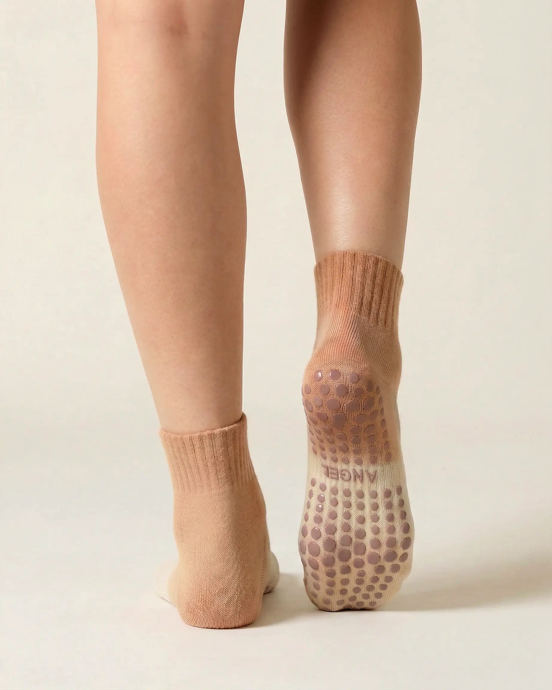 camel | 02 | Camel gradient mid-crew grip socks back standing view showing heel-to-cuff gradient fade, ribbed structure, and full sole grip coverage