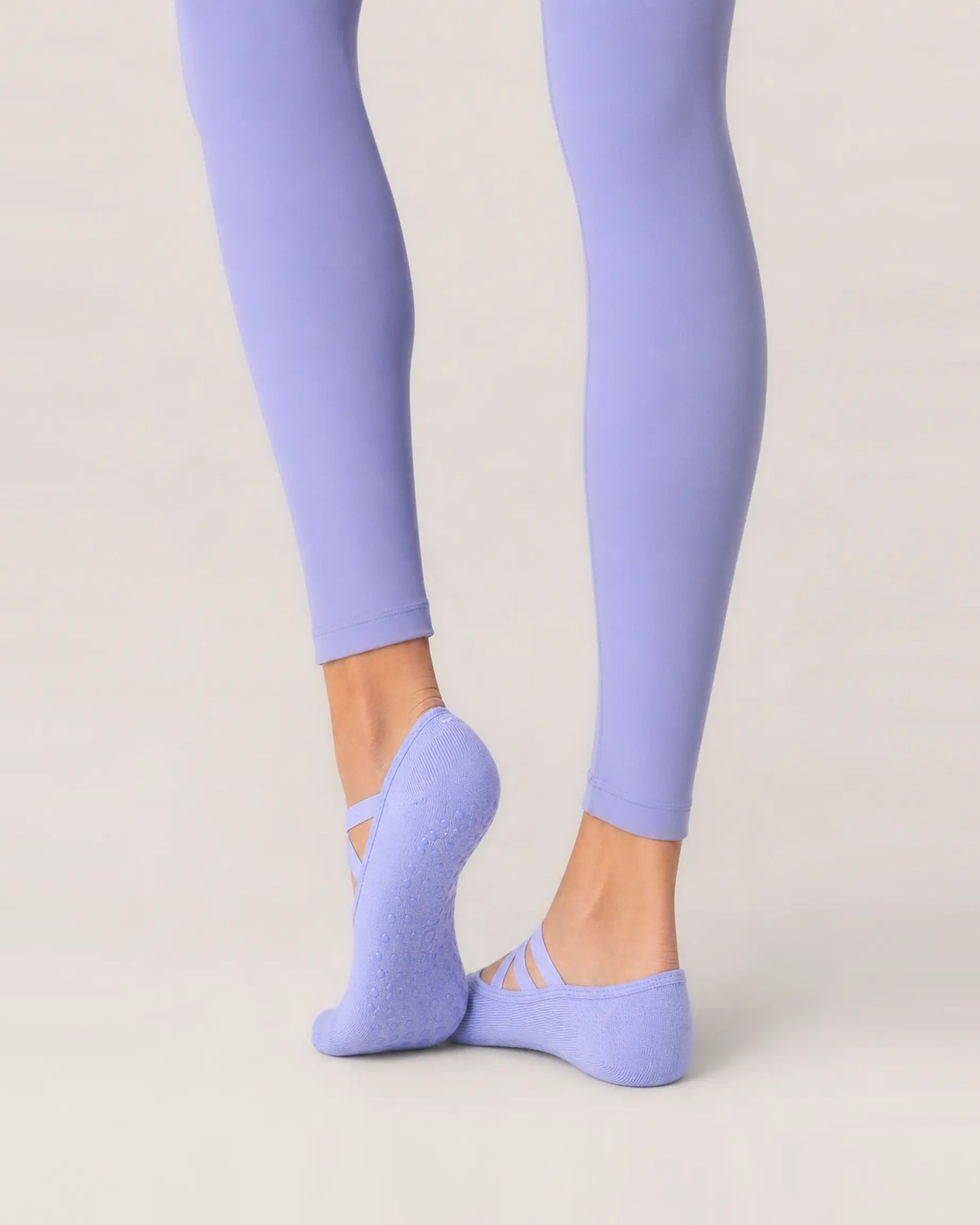 lavender | 04 | Lavender Color-Pop Low-Cut Grip Socks rear angled sole view showing the full-sole grip pattern, covered heel, and low-cut construction