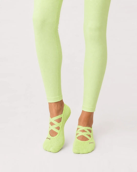 lime | 01 | Lime Color-Pop Low-Cut Grip Socks front angled standing view showing the open-instep crisscross straps, low-cut fit, and mini embroidery detail