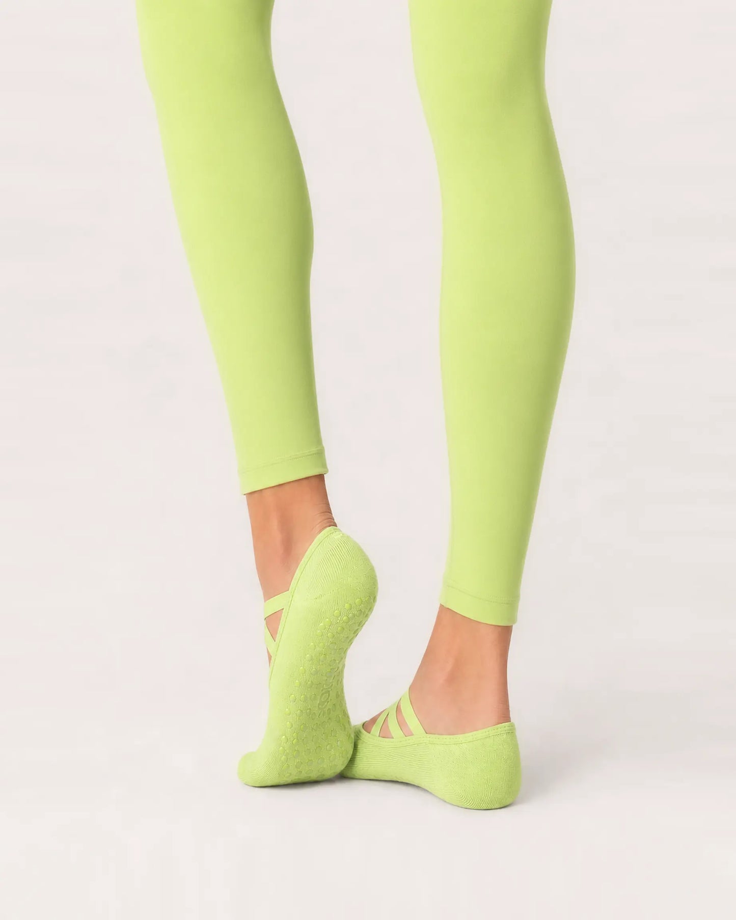 lime | 04 | Lime Color-Pop Low-Cut Grip Socks rear angled sole view showing the full-sole grip pattern, covered heel, and low-cut construction