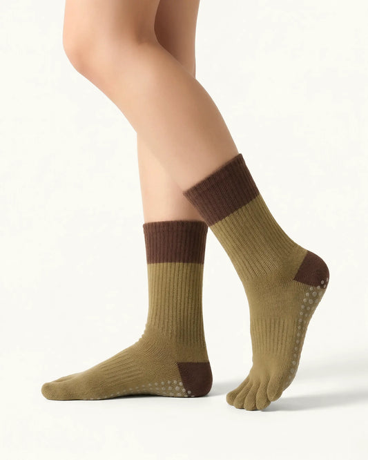 olive-green | 01 | Olive green color block five-toe grip socks side standing view showing ribbed knit texture, contrast cuff and heel, and full-sole grip design