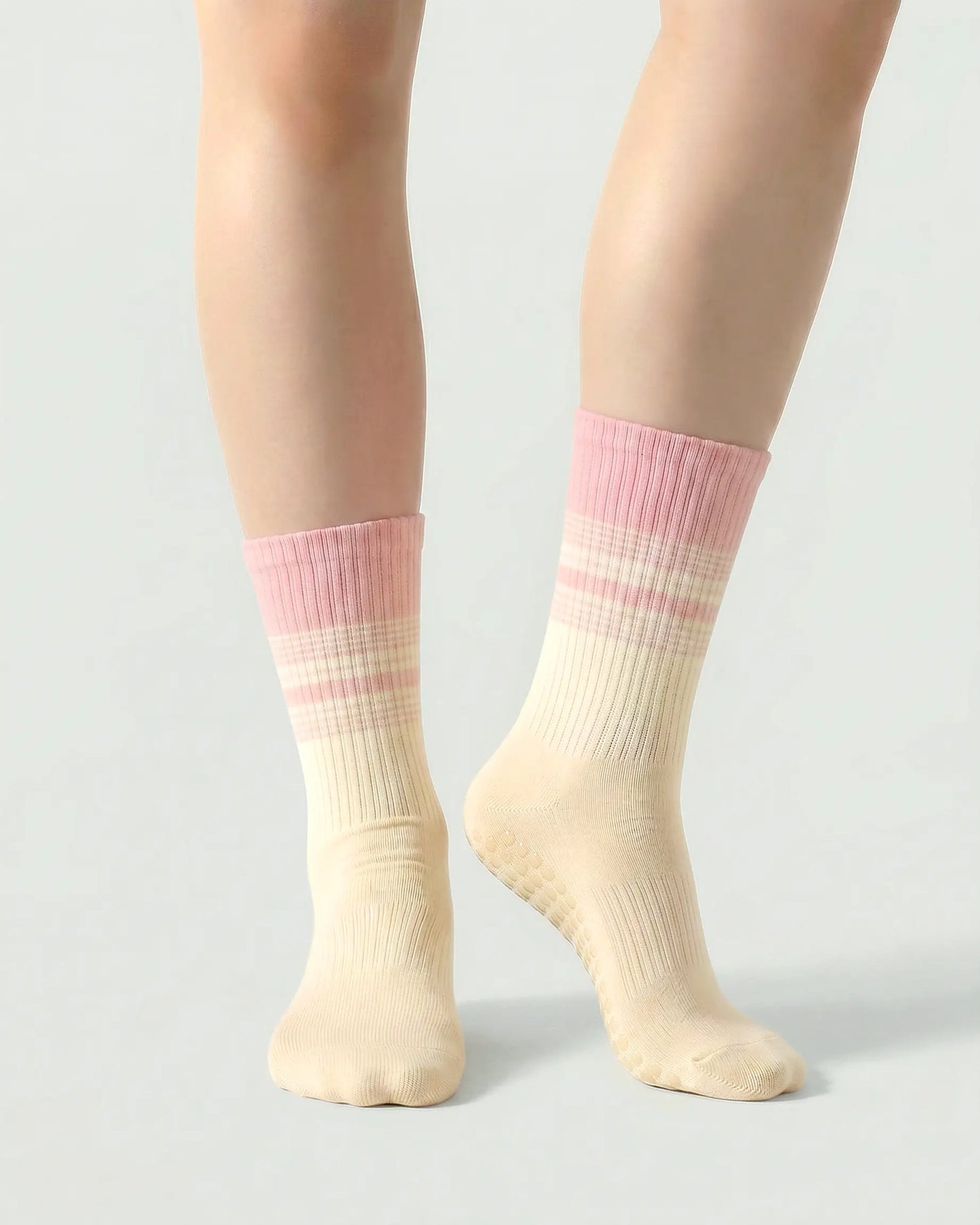 pink-apricot | 04 | Crew grip socks front standing view showing pink-apricot gradient stripe detail, crew length fit, and non-slip sole support