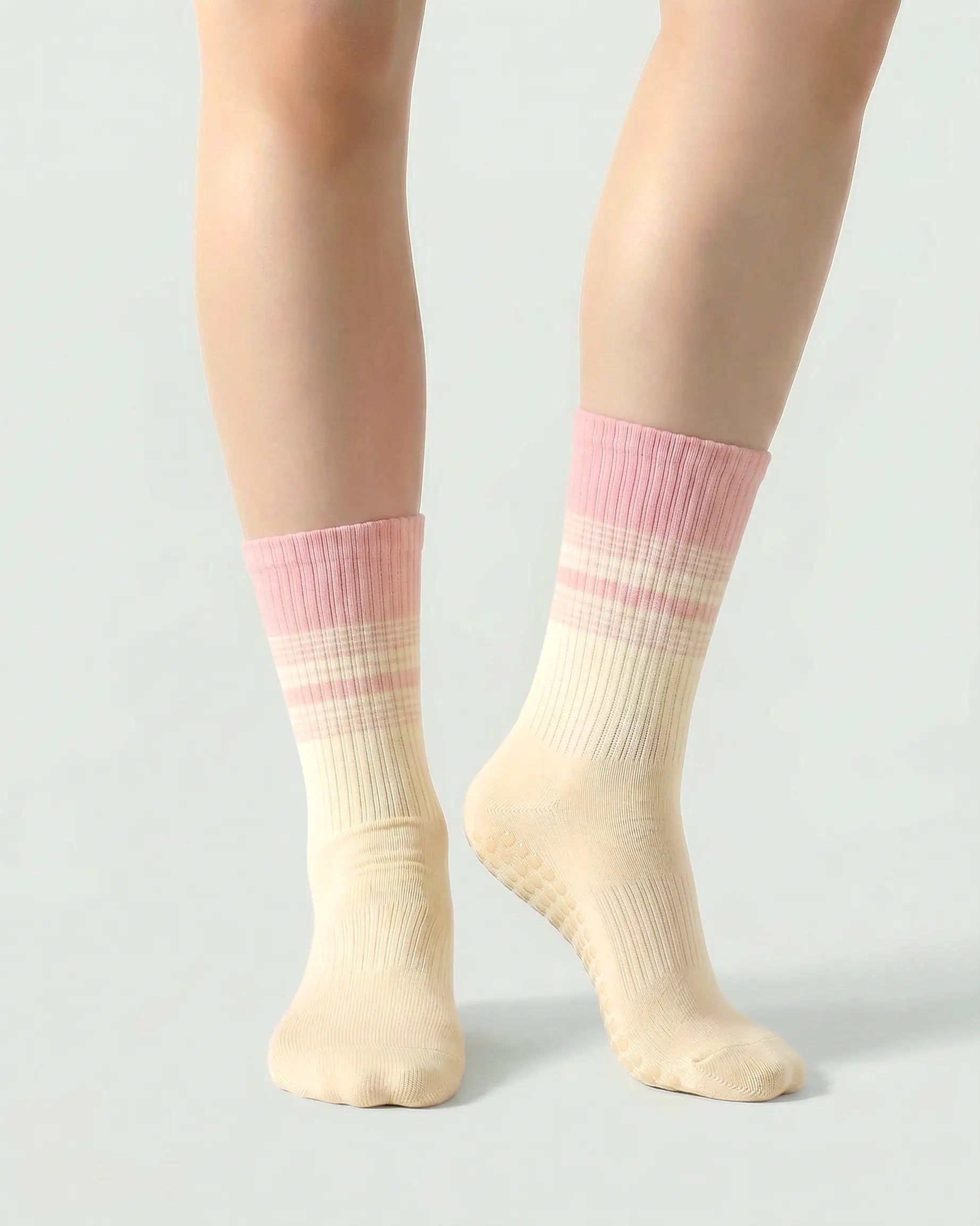 pink-apricot | 04 | Crew grip socks front standing view showing pink-apricot gradient stripe detail, crew length fit, and non-slip sole support