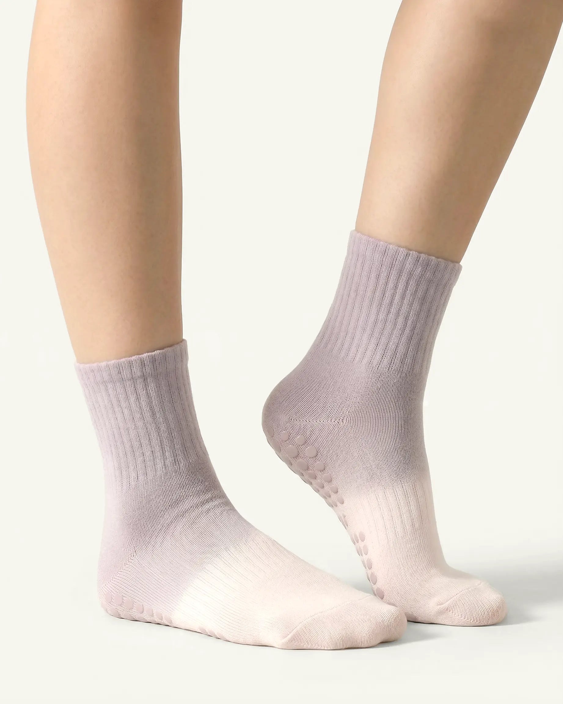 pink-grey | 03 | Pink grey gradient mid-crew grip socks front standing view showing soft ombré color shift, clean mid-crew silhouette, and studio everyday styling