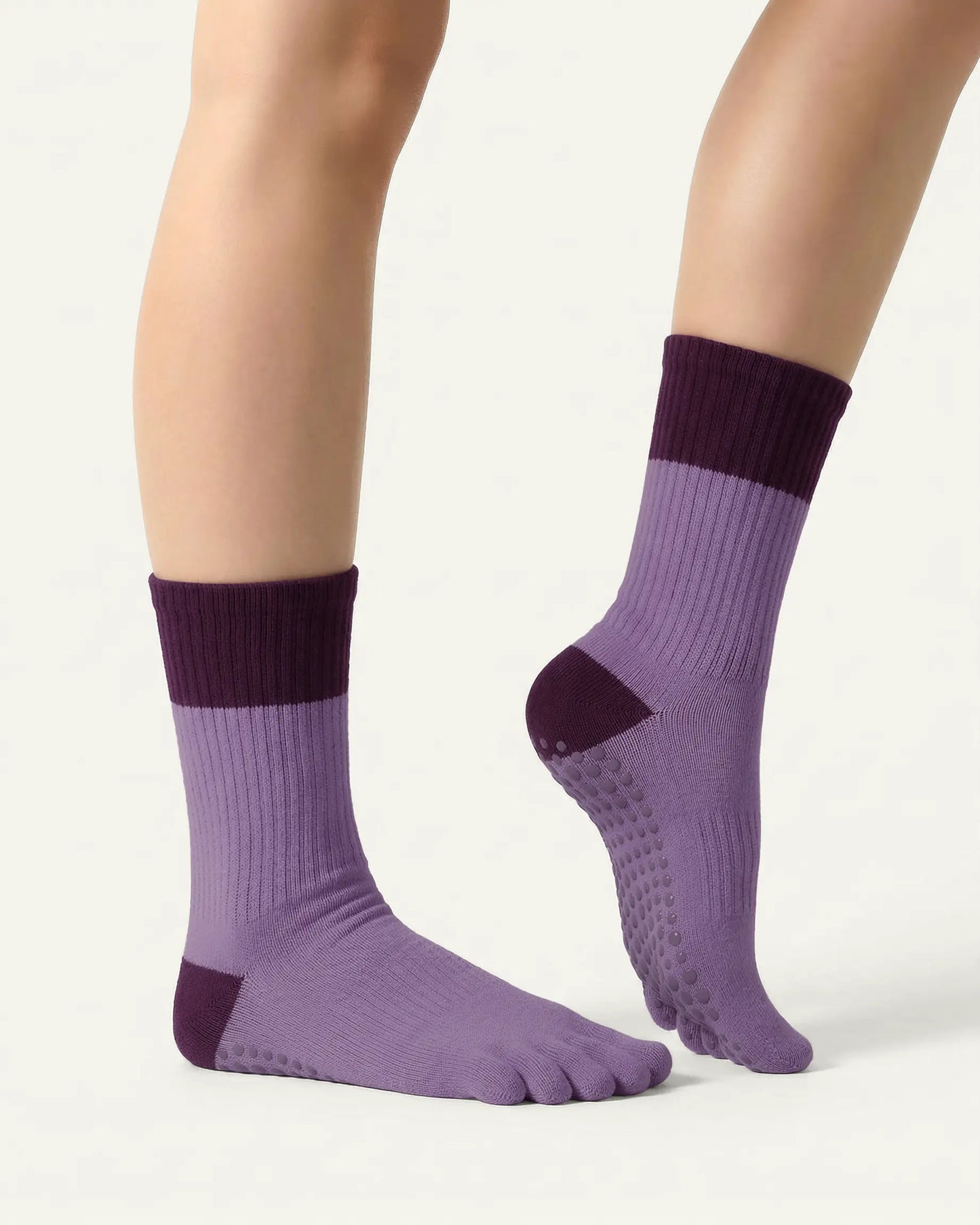 purple | 03 | Purple color block five-toe grip socks side close-up view showing contrast cuff, ribbed body, and structured knit detail