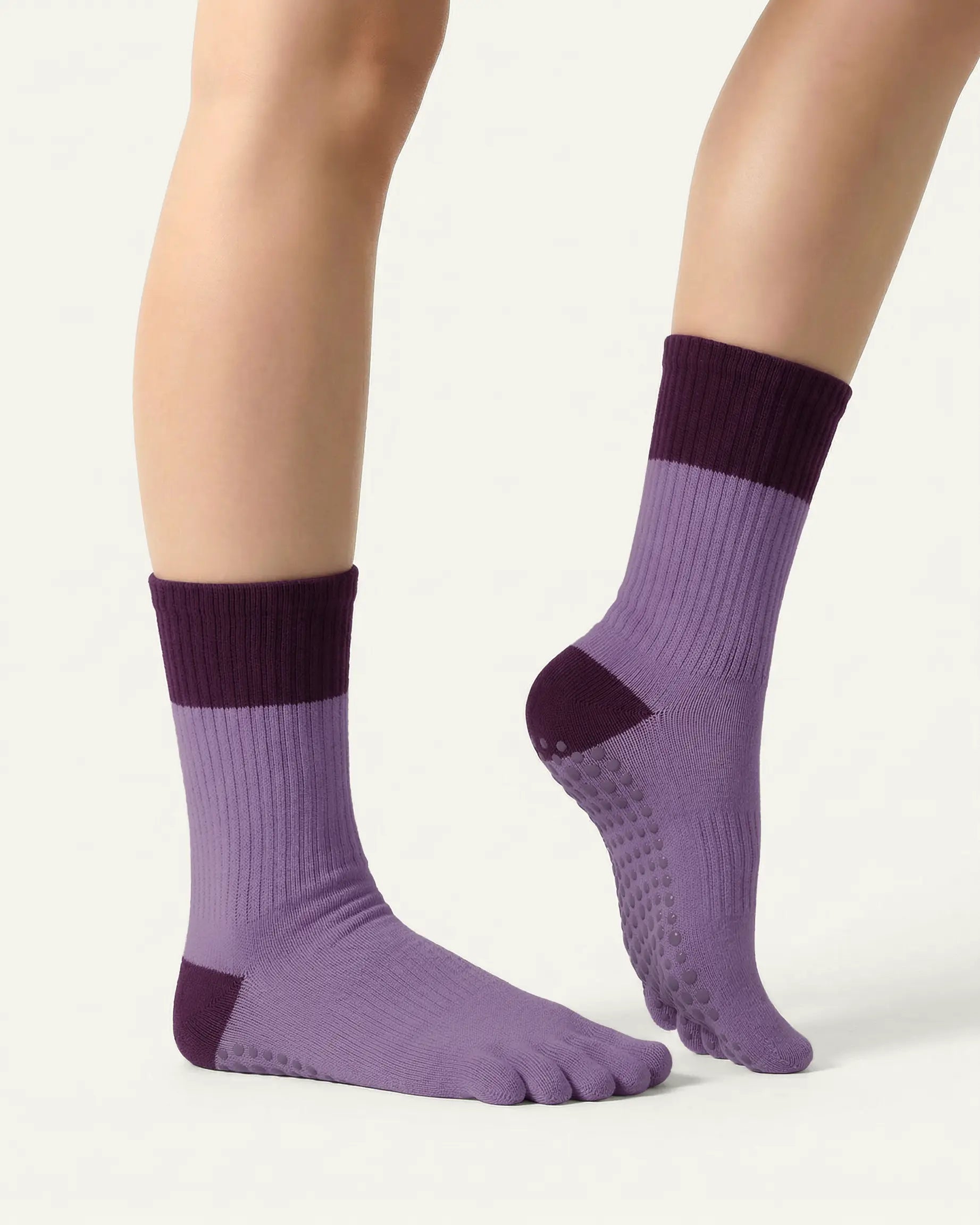 purple | 03 | Purple color block five-toe grip socks side close-up view showing contrast cuff, ribbed body, and structured knit detail