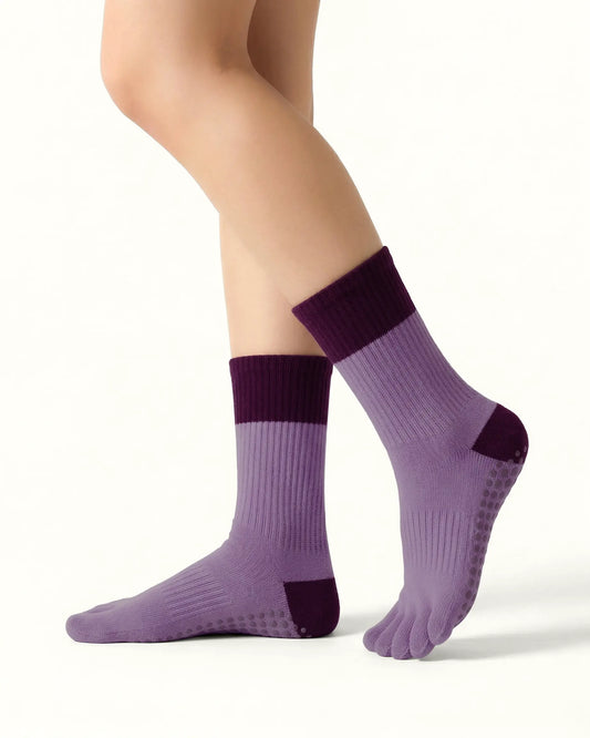 purple | 01 | Purple color block five-toe grip socks side standing view showing ribbed knit texture, contrast cuff and heel, and full-sole grip design