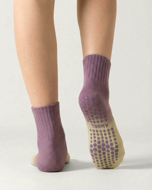 purple-green | 02 | Purple green gradient mid-crew grip socks back standing view showing heel-to-cuff gradient fade, ribbed structure, and full sole grip coverage