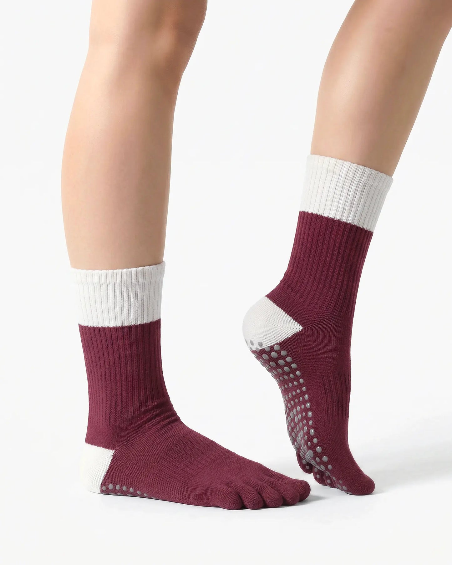 red | 03 | Red color block five-toe grip socks side close-up view showing contrast cuff, ribbed body, and structured knit detail