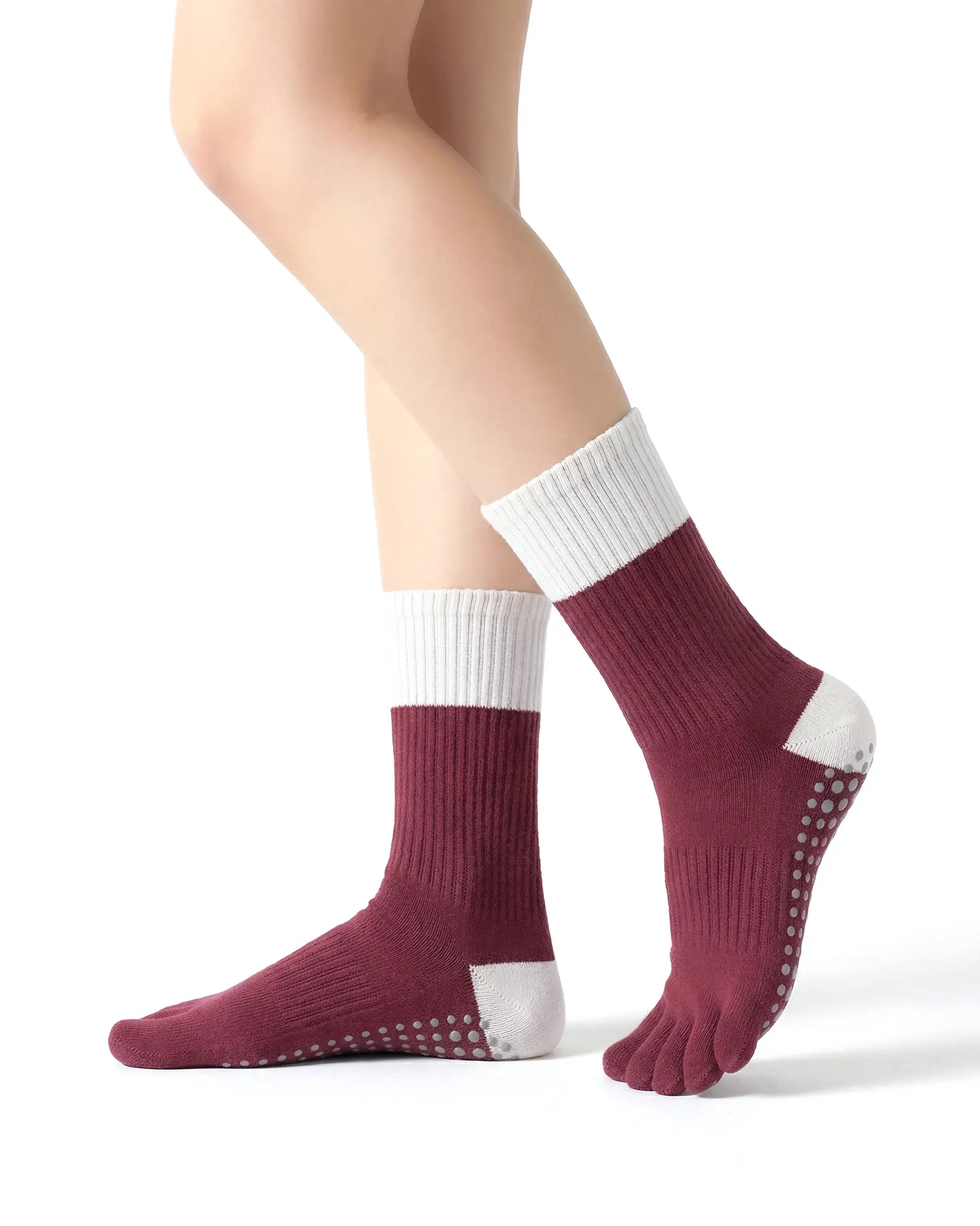 red | 01 | Red color block five-toe grip socks side standing view showing ribbed knit texture, contrast cuff and heel, and full-sole grip design