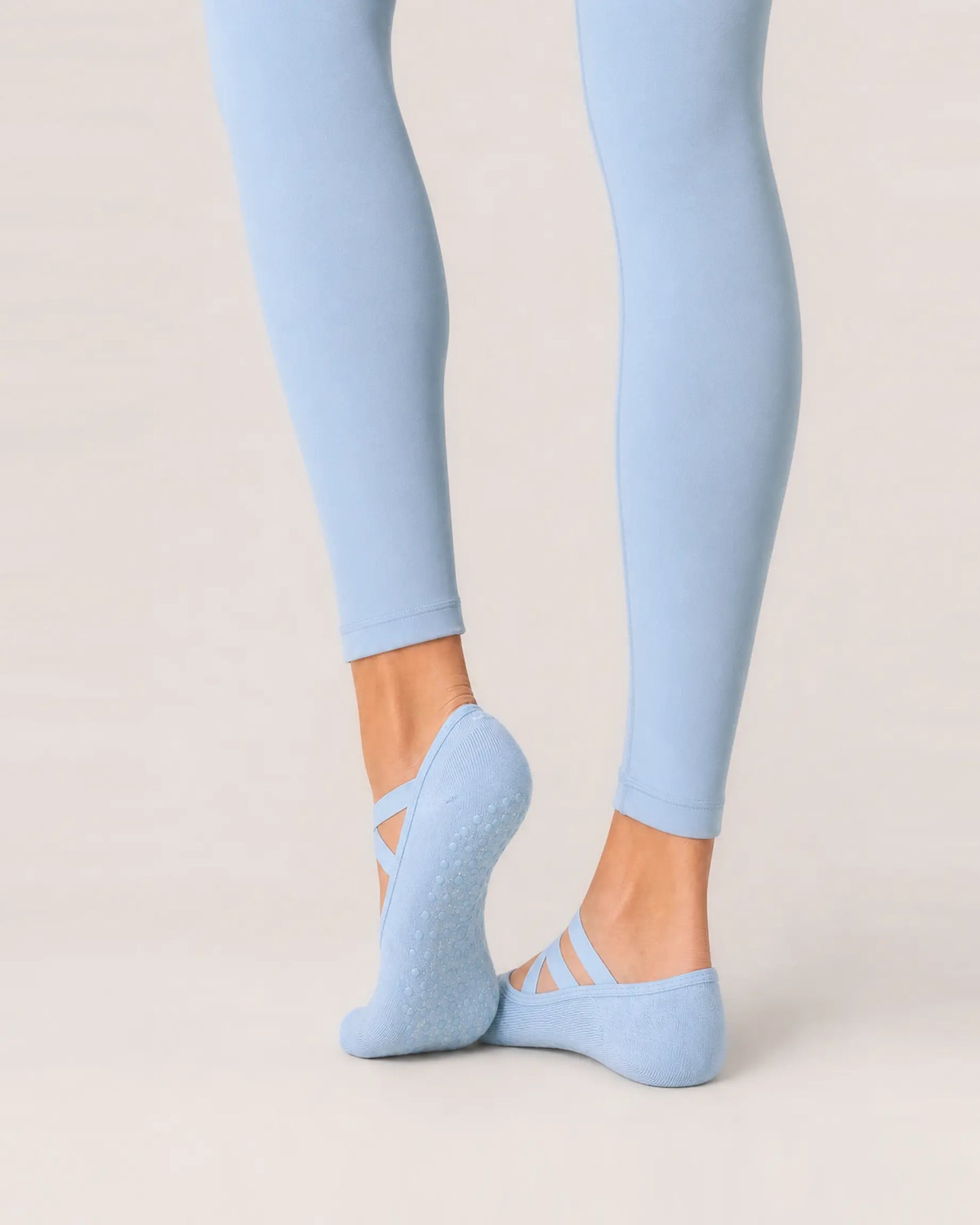 sky-blue | 04 | Sky blue Color-Pop Low-Cut Grip Socks rear angled sole view showing the full-sole grip pattern, covered heel, and low-cut construction