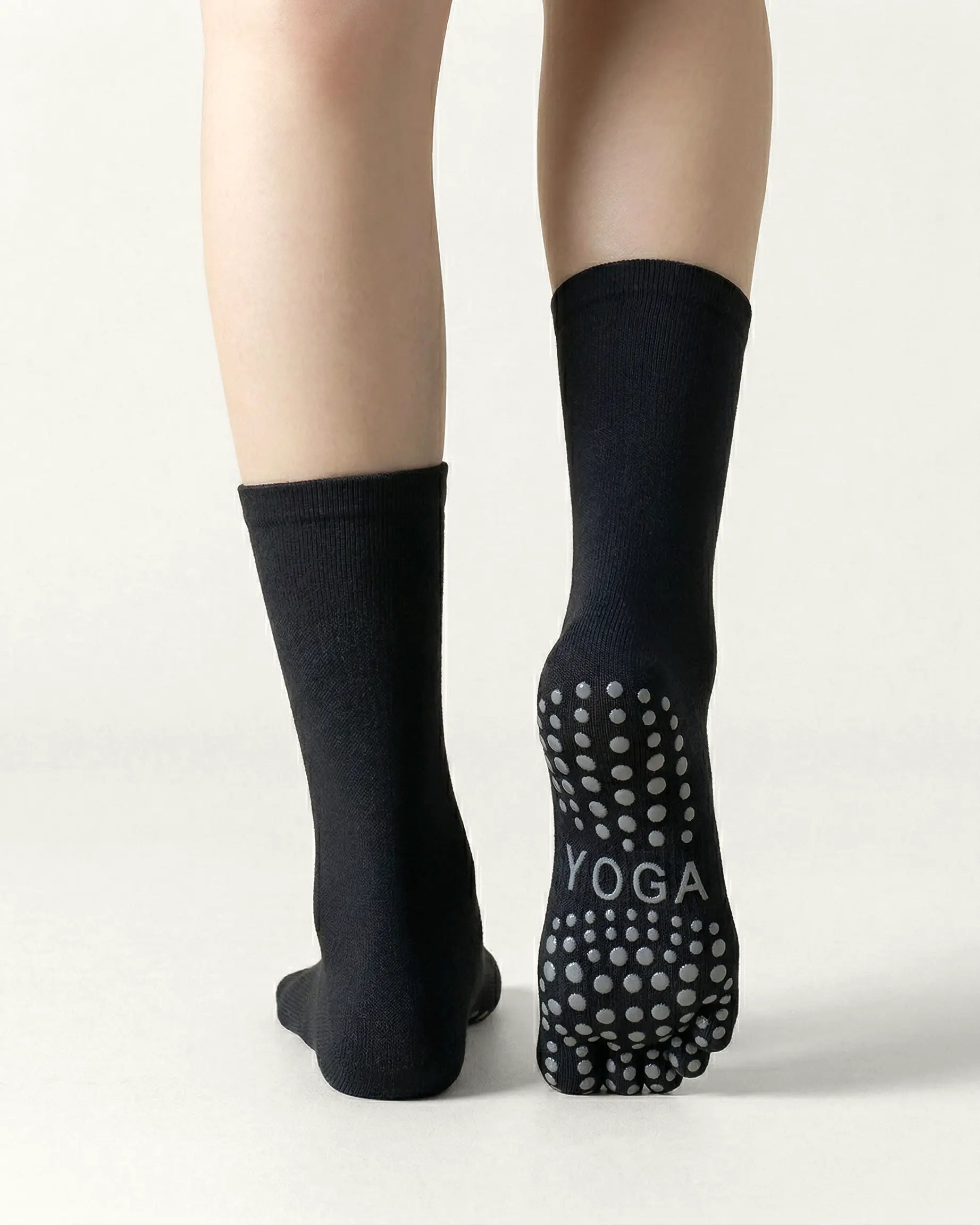 black | 02 | Black minimal five-toe grip socks back view showing sole grip pattern, toe separation, and clean silhouette