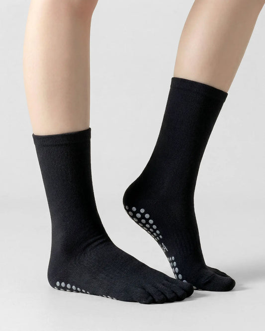 black | 01 | Black minimal five-toe grip socks side lift view showing clean texture, toe separation, and minimal studio look