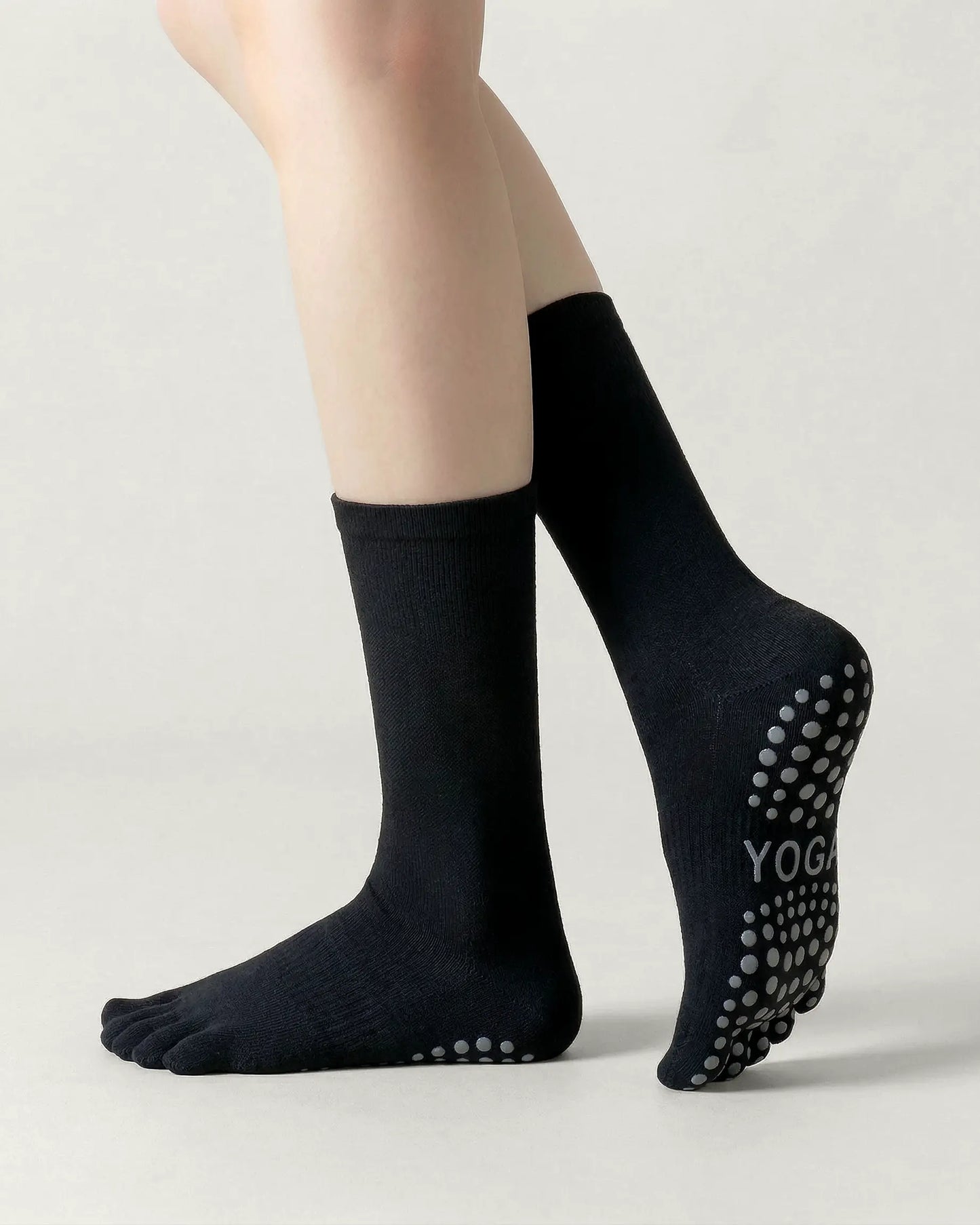 black | 03 | Black minimal five-toe grip socks side standing view showing clean texture, toe separation, and overall fit
