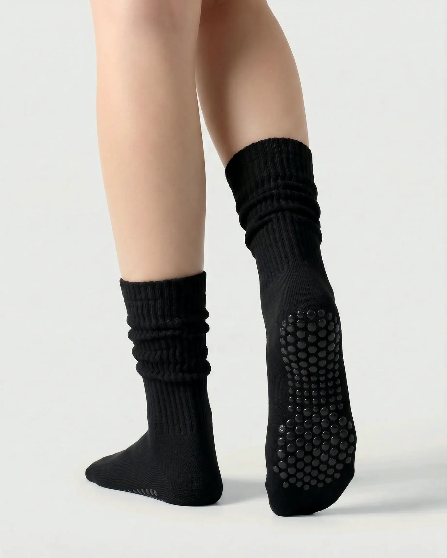black | 02 | Black yellow slouch grip socks back side view showing slouch shape, grip sole detail, and soft ribbed texture