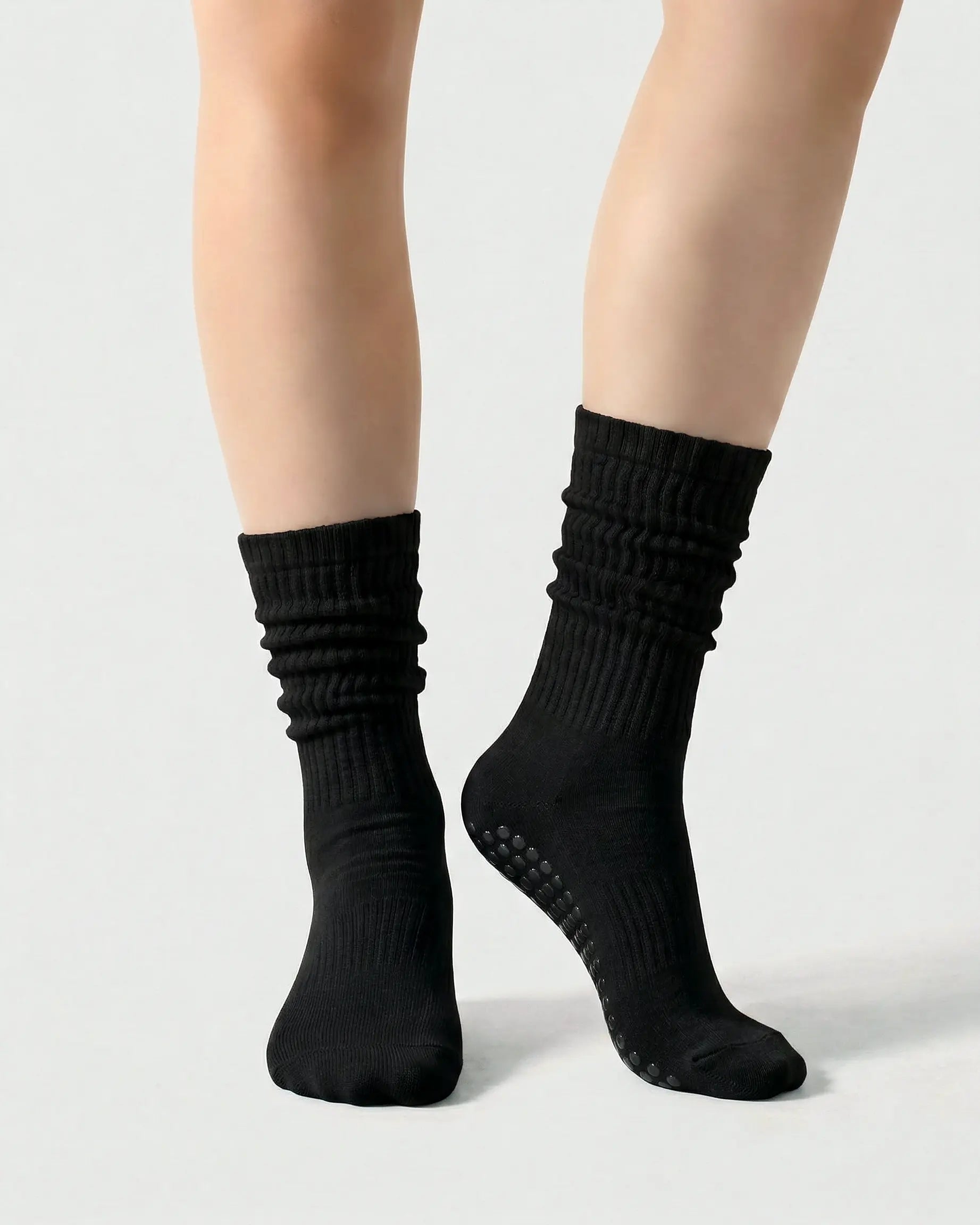 black | 04 | Black slouch grip socks front standing view showing crew height, relaxed slouch silhouette, and clean non-slip studio sock styling