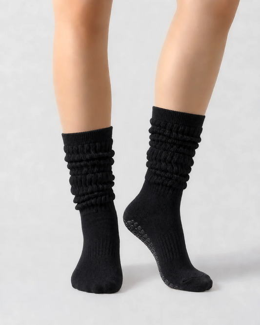 black | 04 | Black slouch grip socks front standing view showing crew height, relaxed slouch silhouette, and clean non-slip studio sock styling