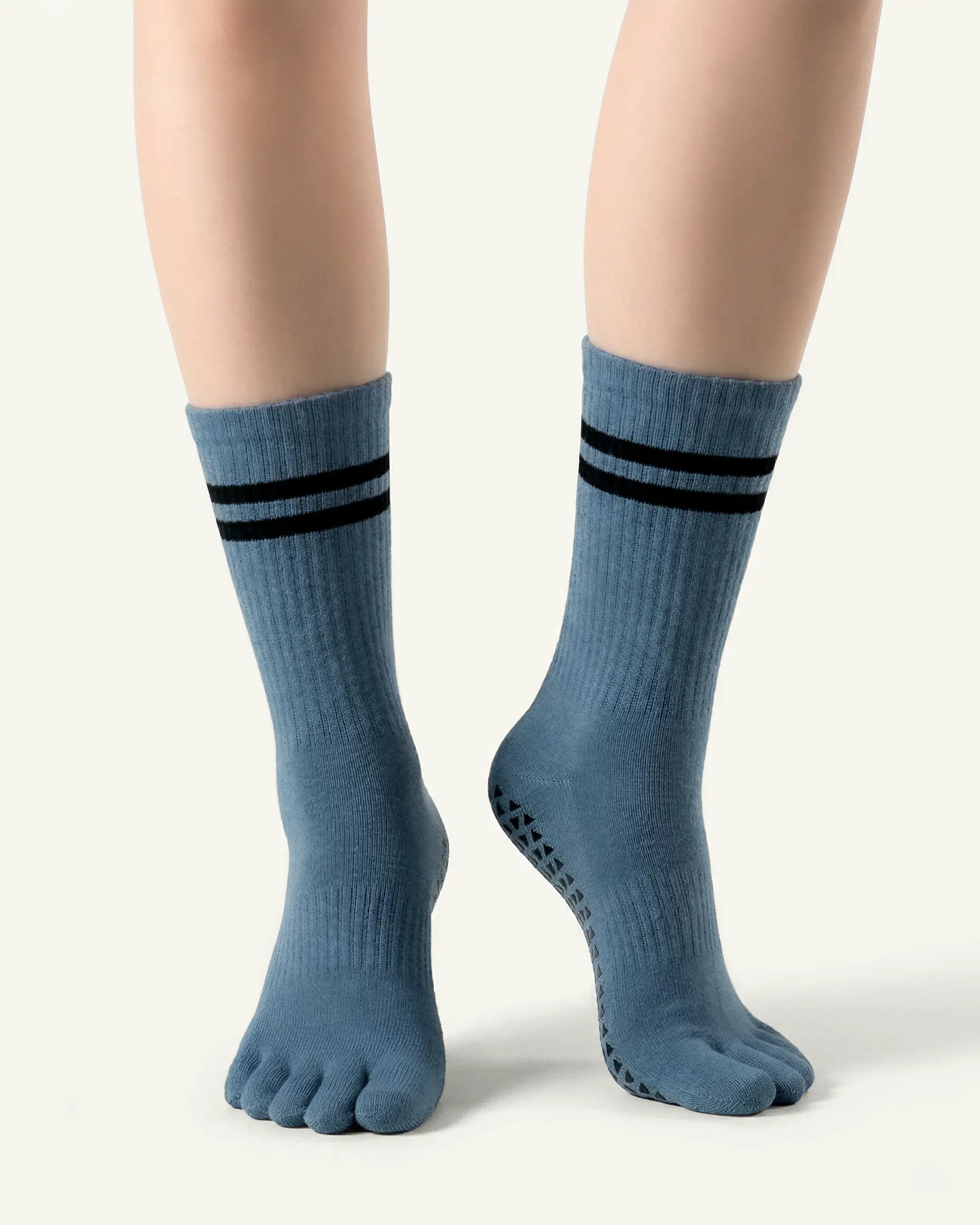 blue-grey | 04 | Blue grey double-stripe five-toe grip socks front standing view showing stripe detail, toe separation, and overall fit