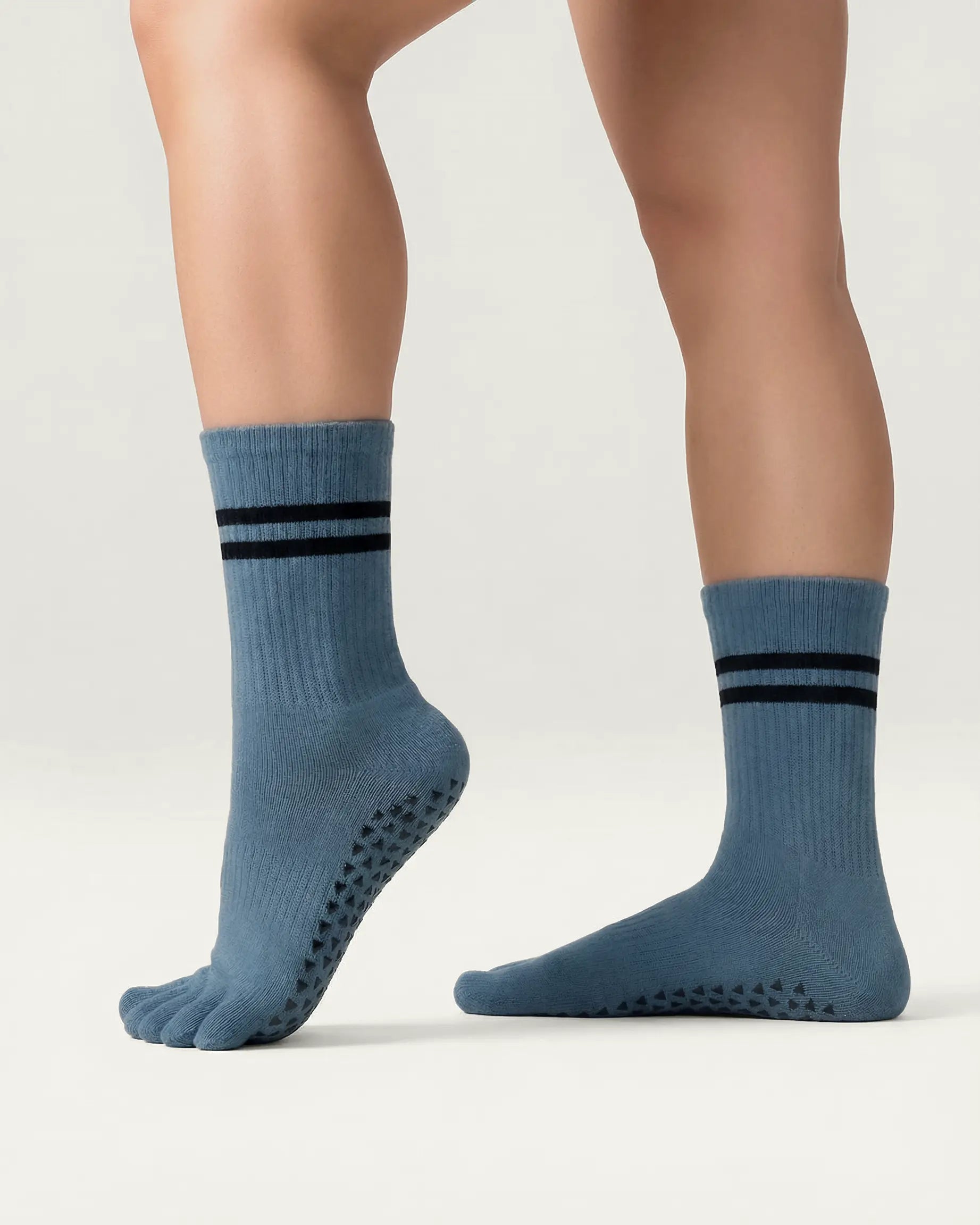 blue-grey | 03 | Blue grey double-stripe five-toe grip socks side standing view showing ribbed texture, stripe detail, and five-toe silhouette