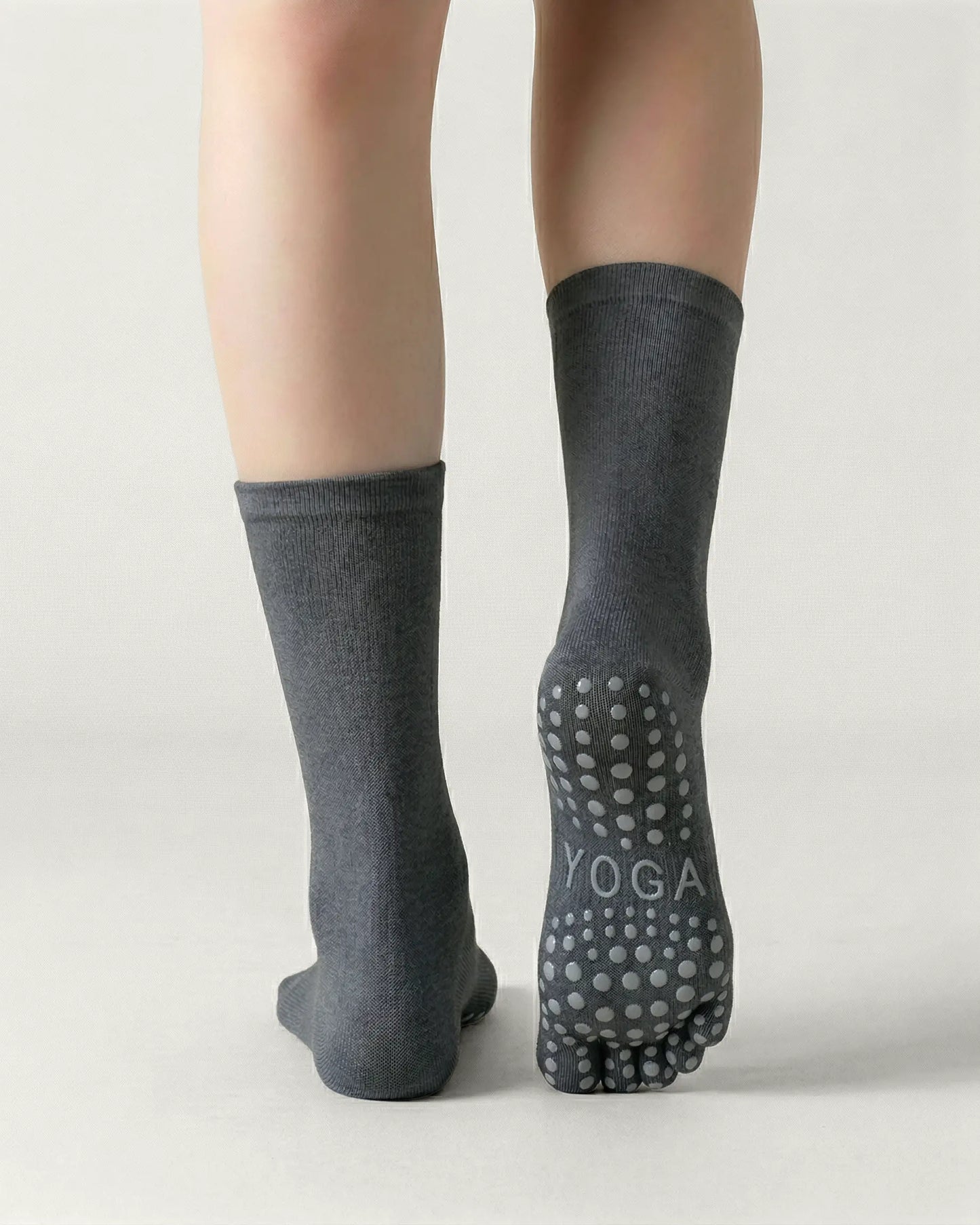 dark-grey | 02 | Dark-grey minimal five-toe grip socks back view showing sole grip pattern, toe separation, and clean silhouette