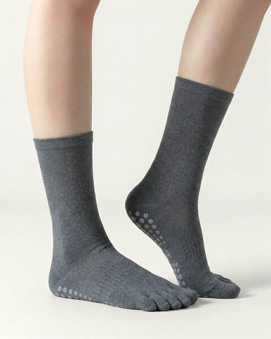 dark-grey | 01 | Dark-grey minimal five-toe grip socks side lift view showing clean texture, toe separation, and minimal studio look