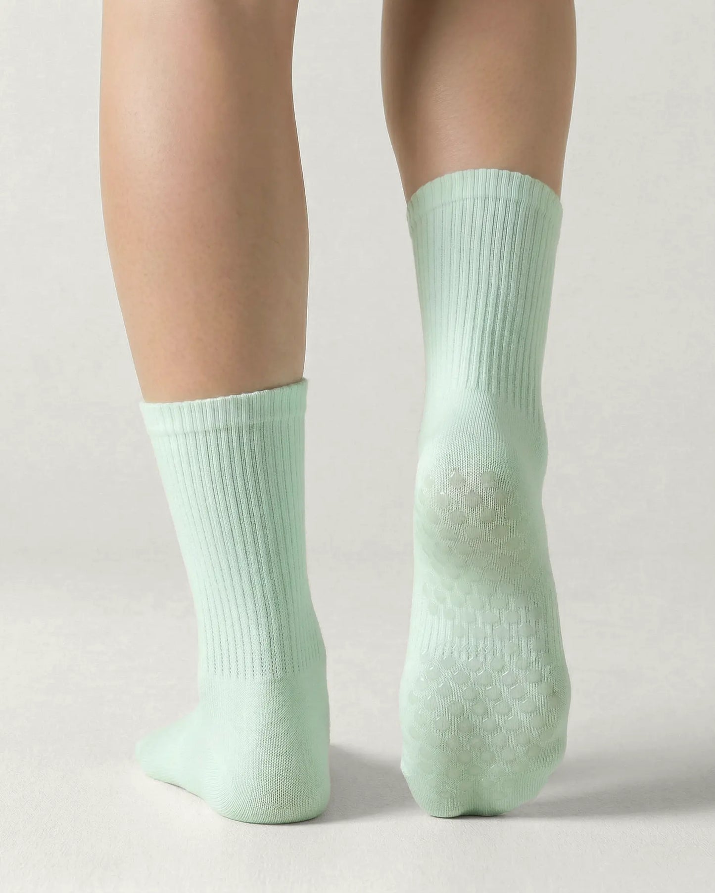 green | 02 | Green crew grip socks back view showing sole grip pattern and ribbed knit texture