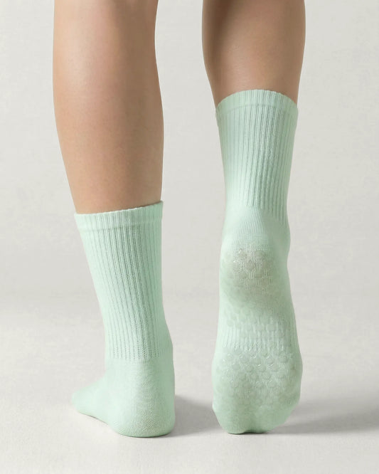 green | 02 | Green crew grip socks back view showing sole grip pattern and ribbed knit texture