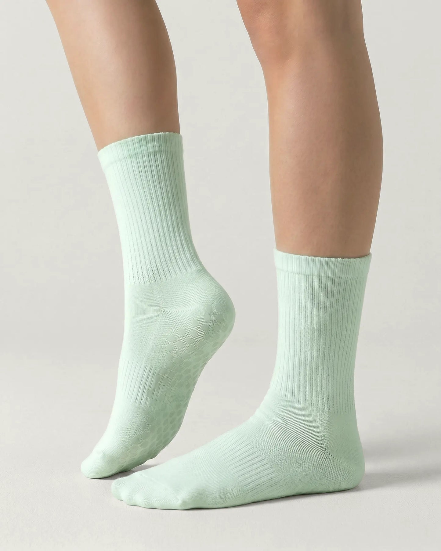 green | 01 | Green crew grip socks side lift view showing ribbed texture and crew length