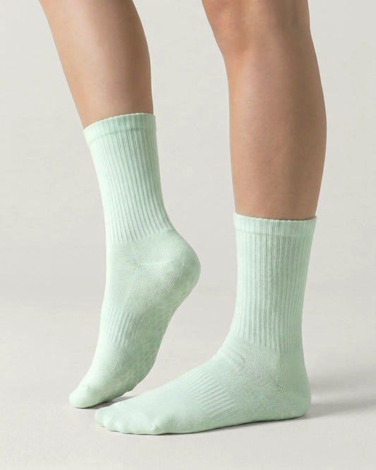 green | 01 | Green crew grip socks side lift view showing ribbed texture and crew length