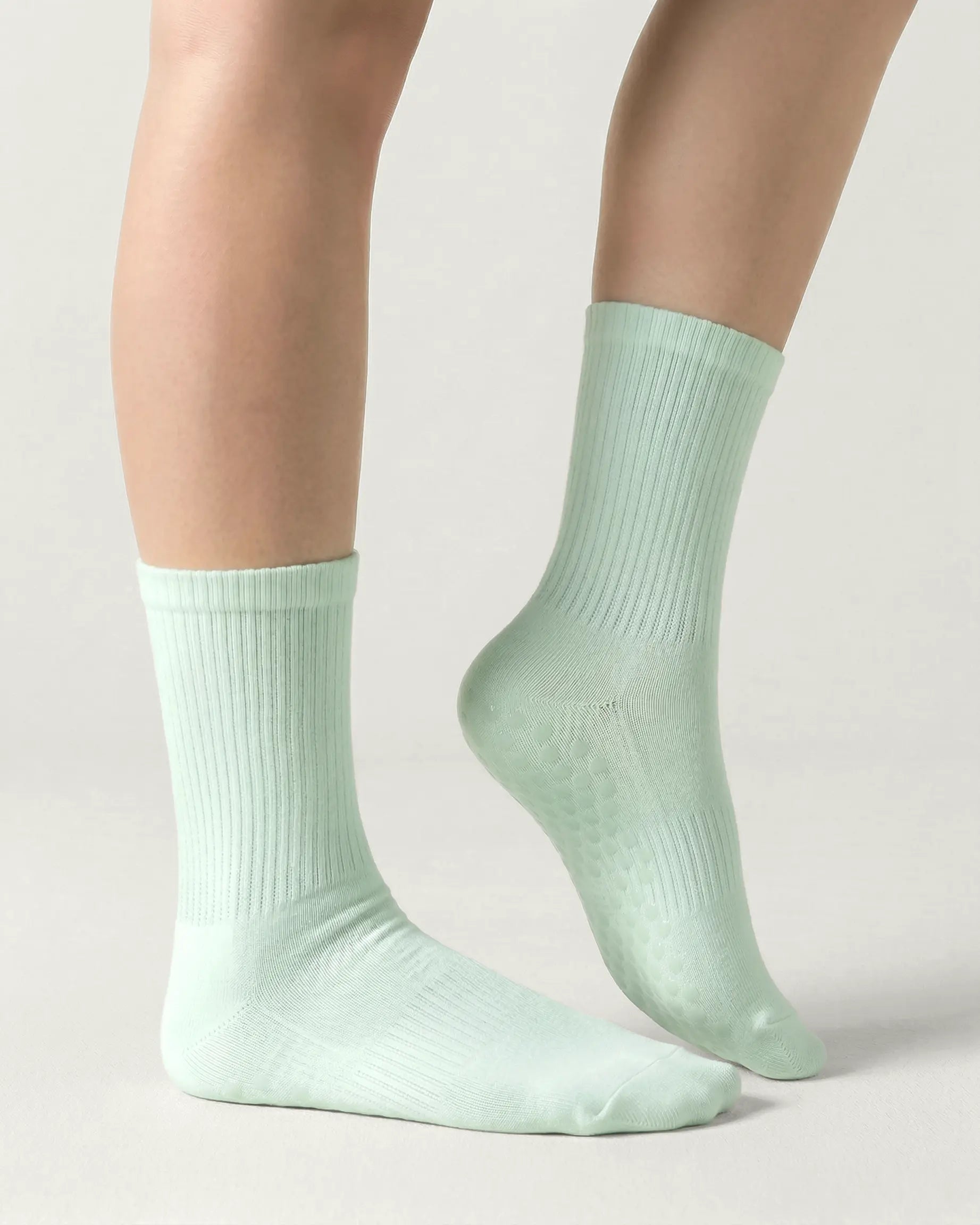green | 03 | Green crew grip socks side standing view showing clean silhouette and crew fit