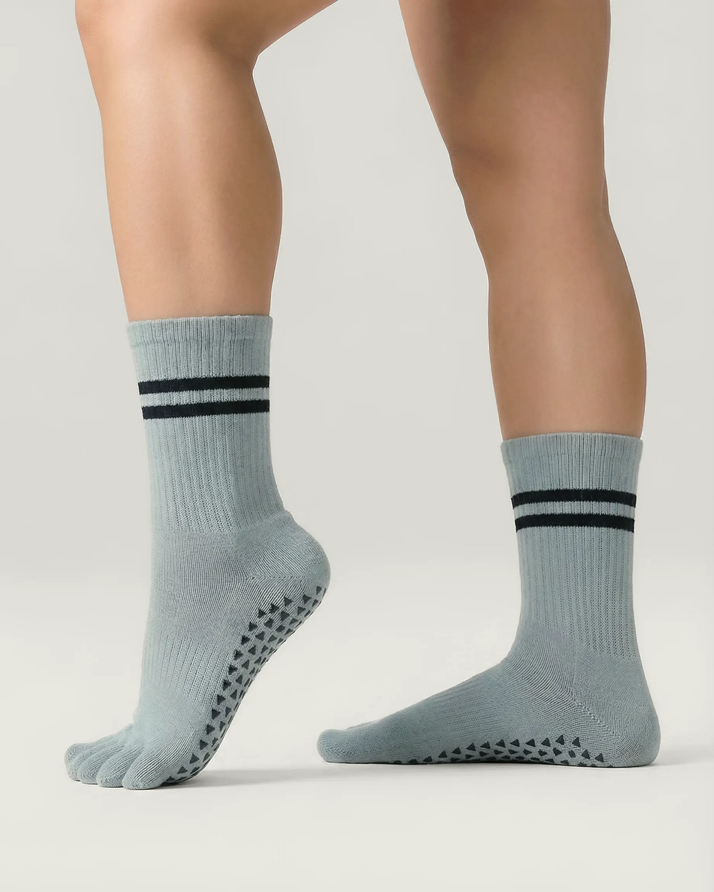 grey-green | 03 | Grey green double-stripe five-toe grip socks side standing view showing ribbed texture, stripe detail, and five-toe silhouette
