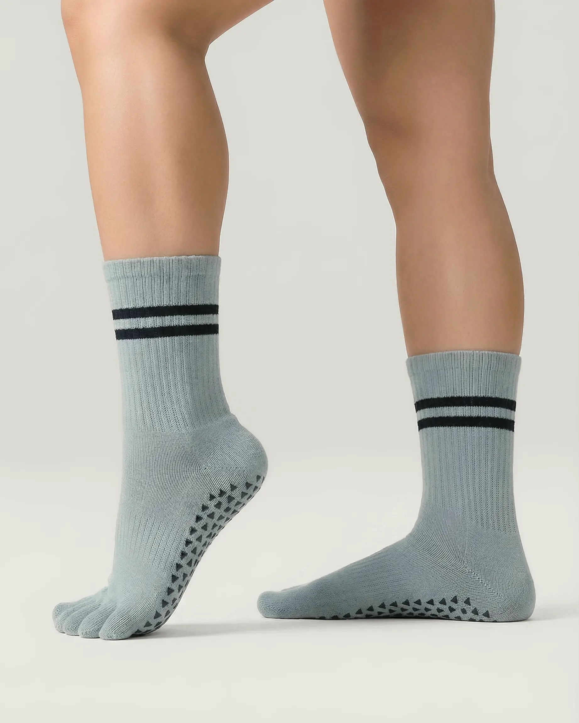 grey-green | 03 | Grey green double-stripe five-toe grip socks side standing view showing ribbed texture, stripe detail, and five-toe silhouette