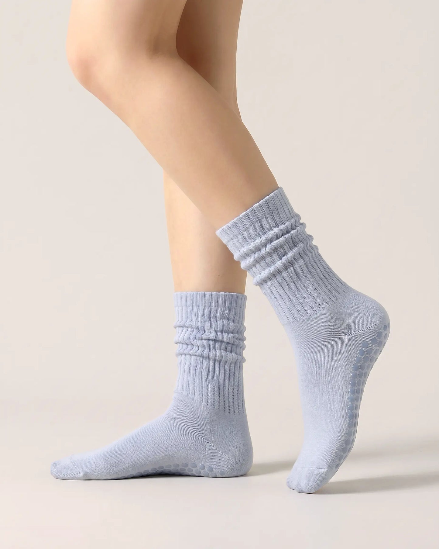 light-blue | 01 | Light blue slouch grip socks side slouch standing view showing relaxed ribbed texture, crew length, and soft studio styling
