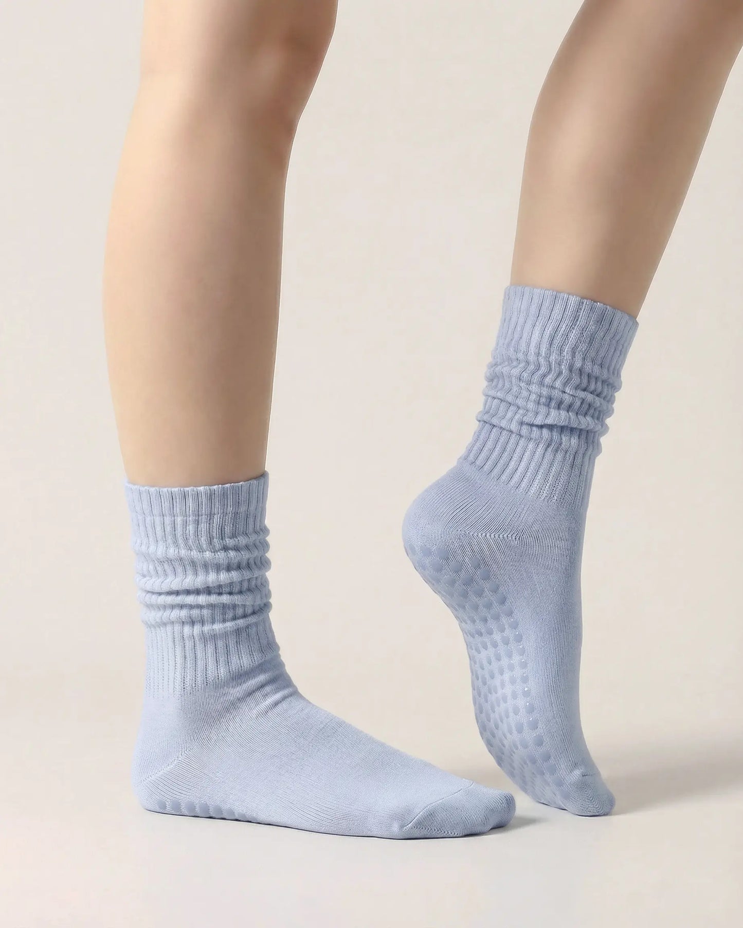 light-blue | 03 | Light blue slouch grip socks side standing view showing relaxed slouch fit, ribbed knit texture, and minimal studio look