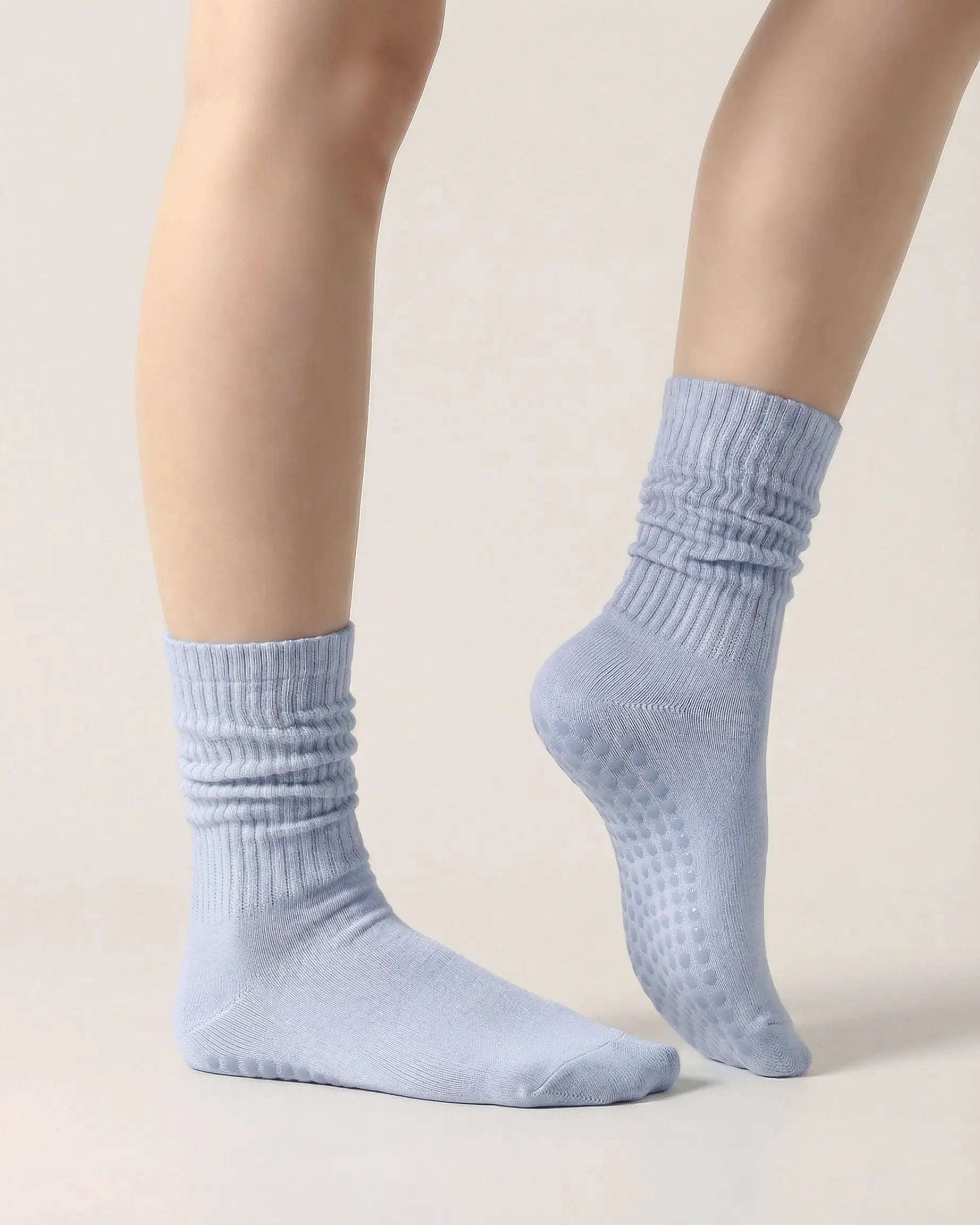 light-blue | 03 | Light blue slouch grip socks side standing view showing relaxed slouch fit, ribbed knit texture, and minimal studio look
