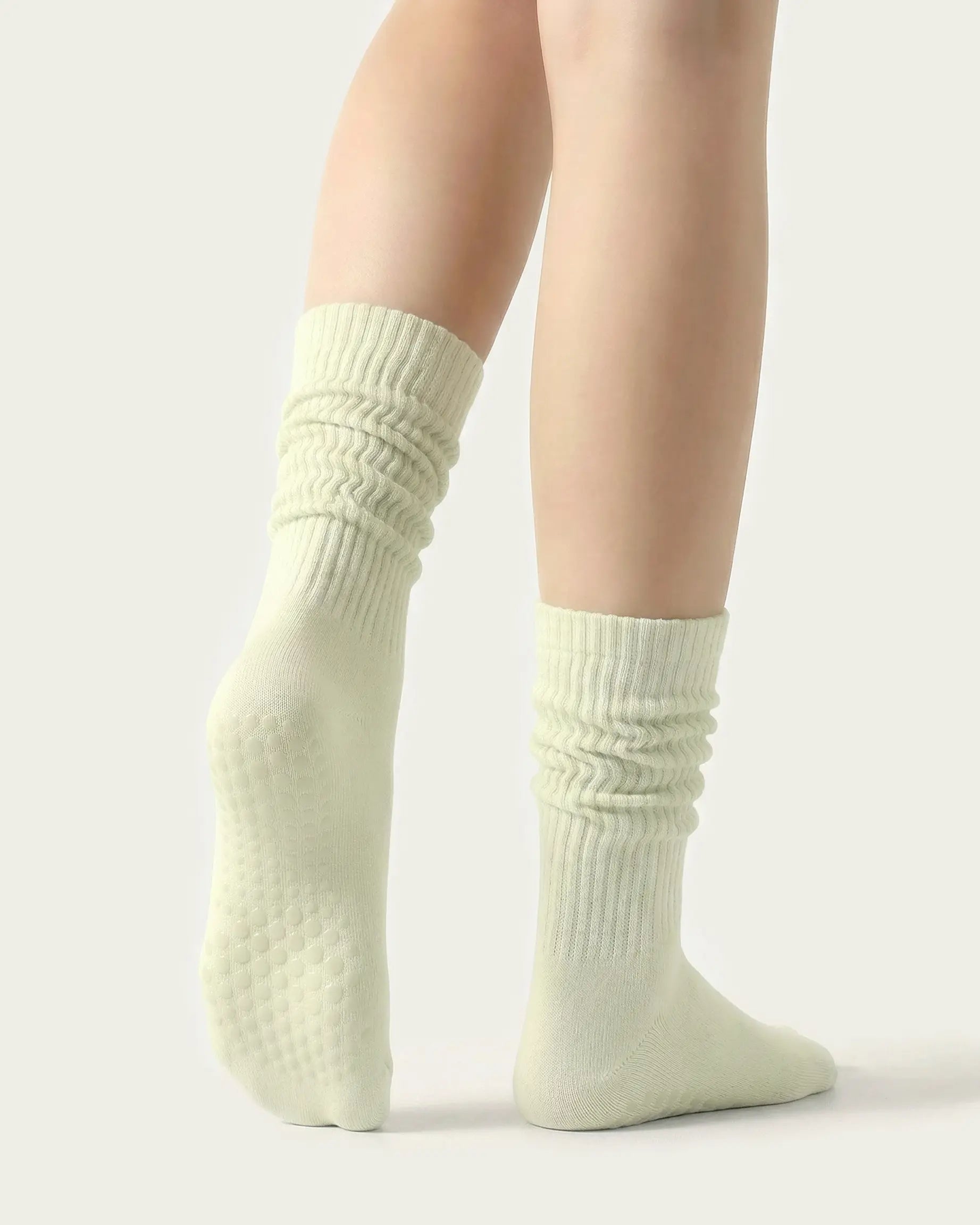 light-green | 02 | Light green slouch grip socks back side view showing slouch shape, grip sole detail, and soft ribbed texture