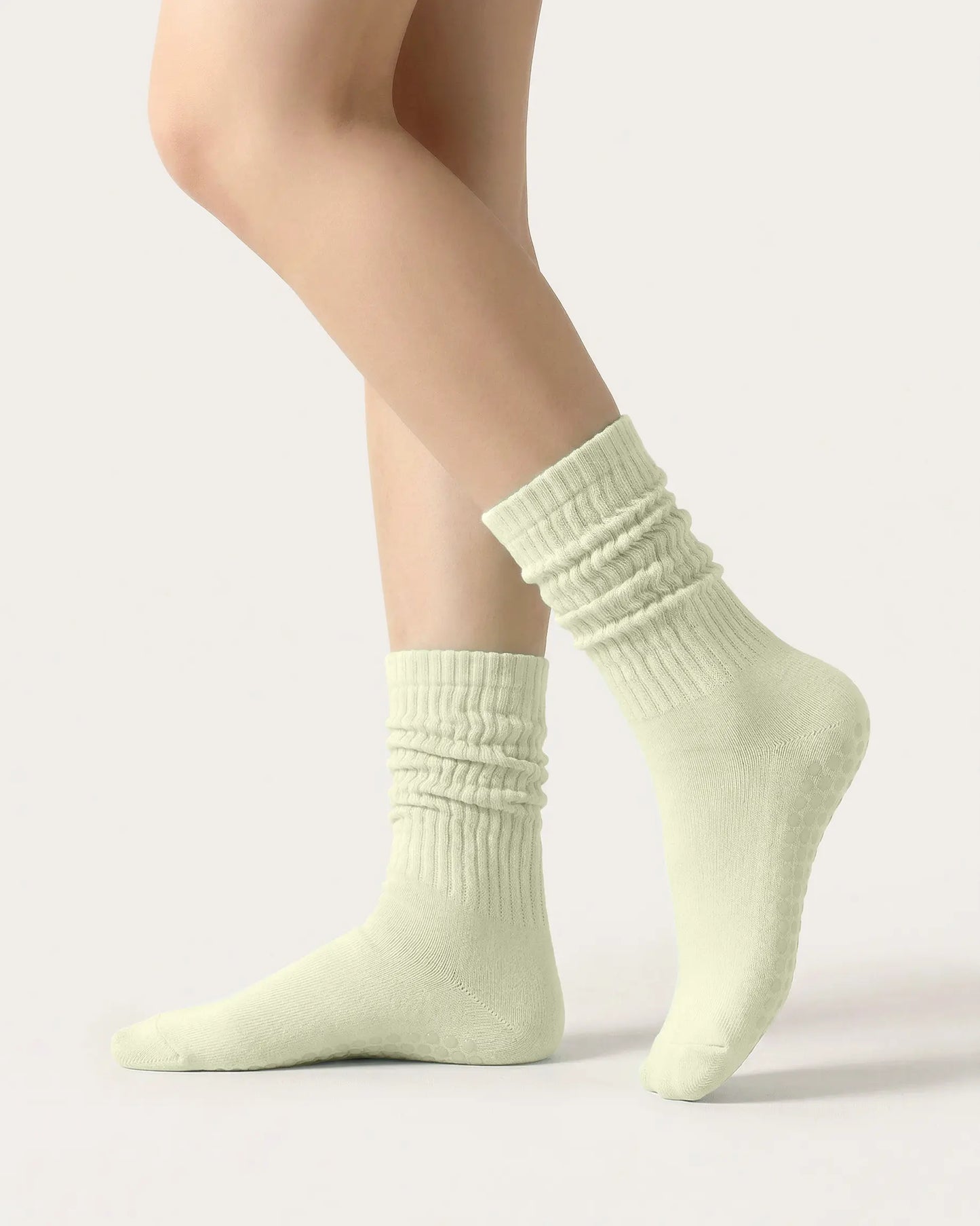 light-green | 01 | Light green slouch grip socks side slouch standing view showing relaxed ribbed texture, crew length, and soft studio styling