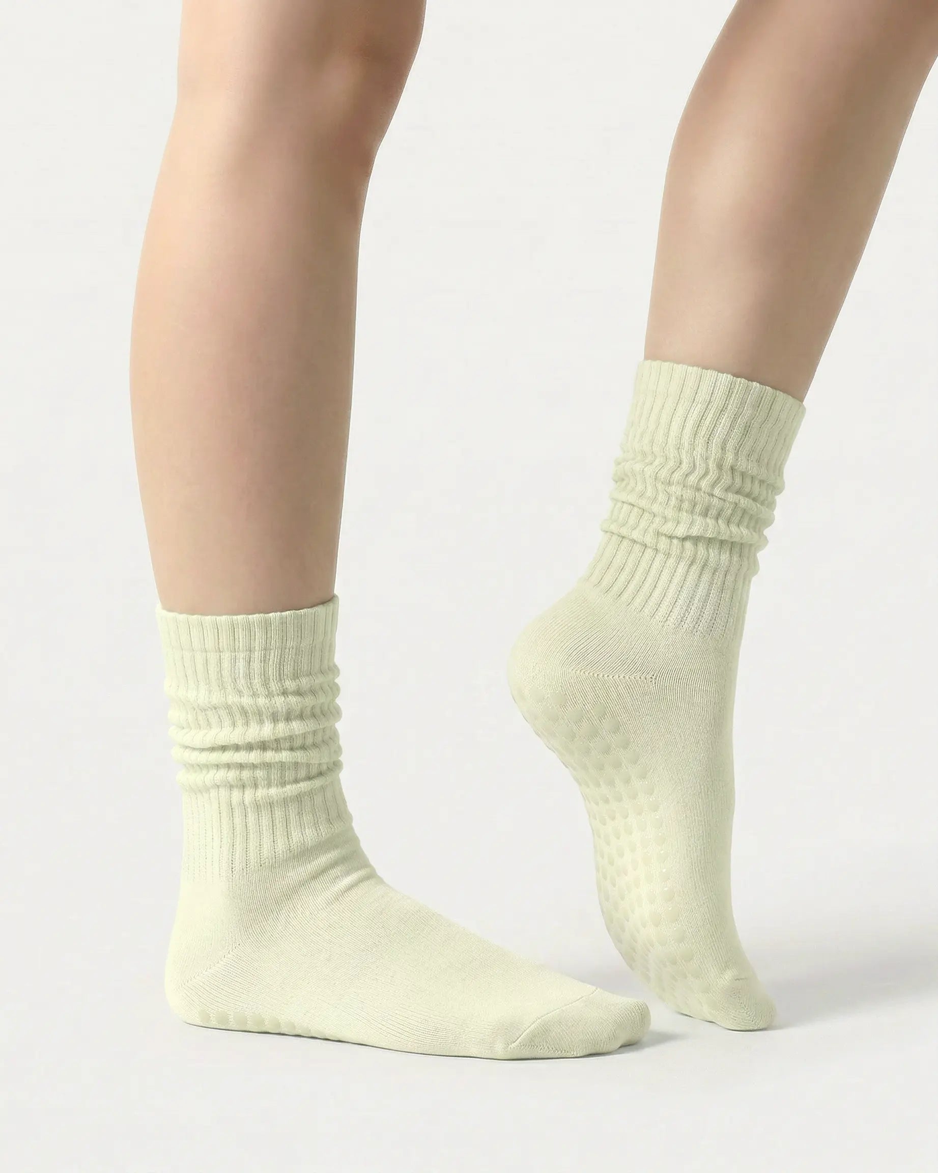 light-green | 03 | Light green slouch grip socks side standing view showing relaxed slouch fit, ribbed knit texture, and minimal studio look