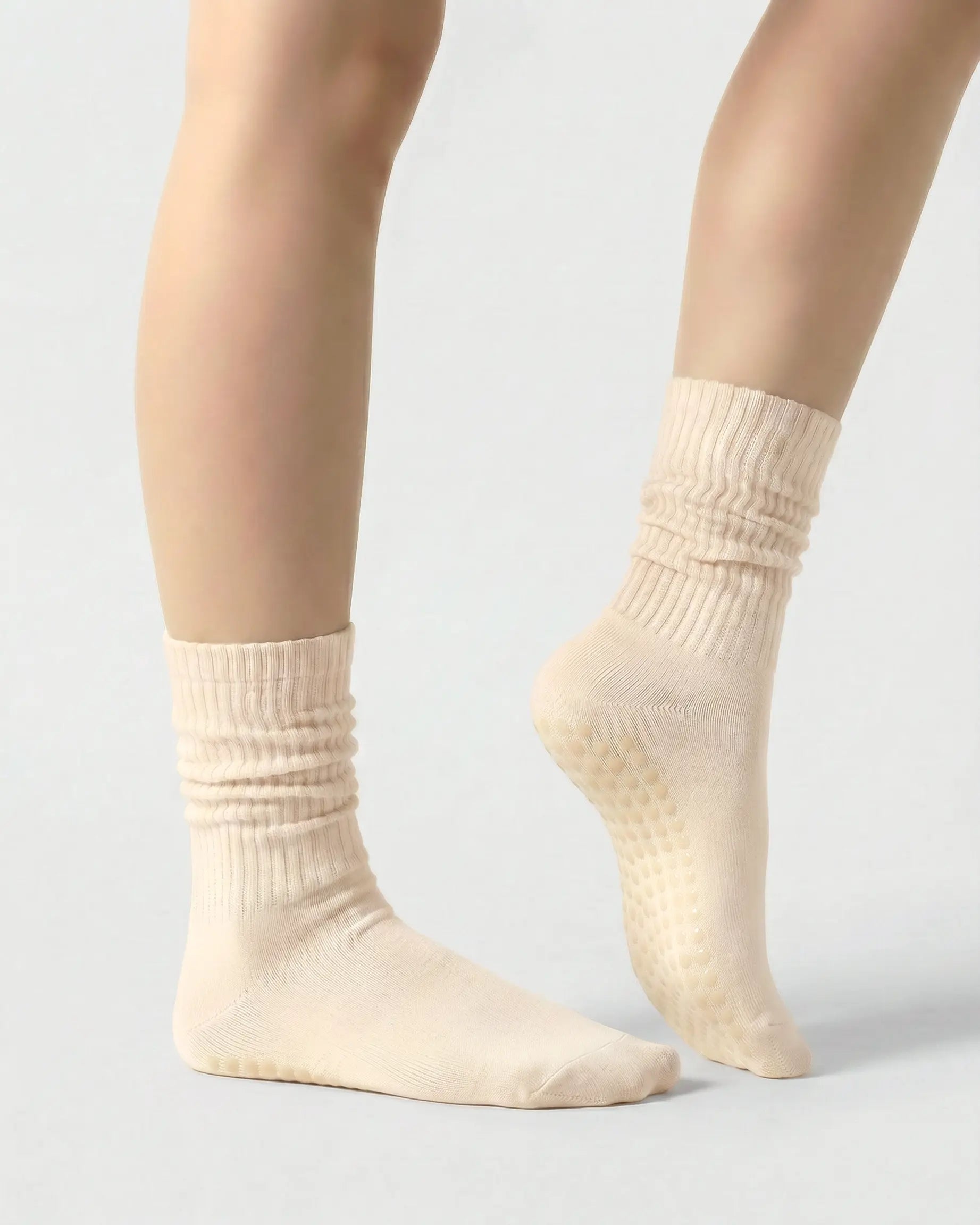 light-yellow | 03 | Light yellow slouch grip socks side standing view showing relaxed slouch fit, ribbed knit texture, and minimal studio look
