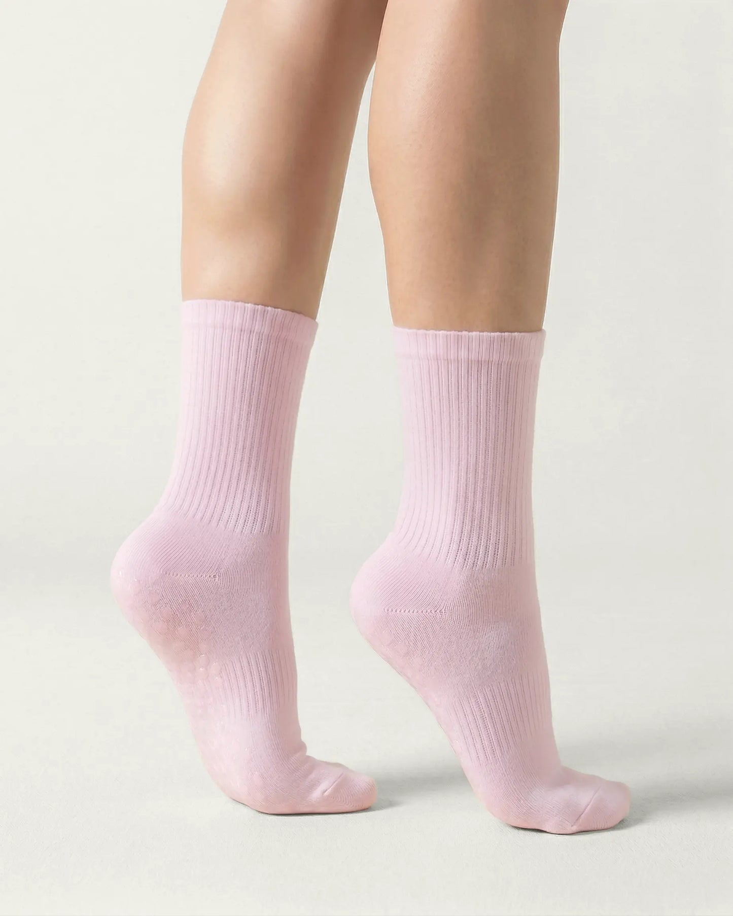 pink | 04 | Pink crew grip socks front angled view showing ribbed texture and crew height
