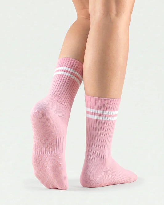 pink | 02 | Pink double-stripe crew grip socks back view showing sole grip pattern, ribbed knit texture, and stripe detail