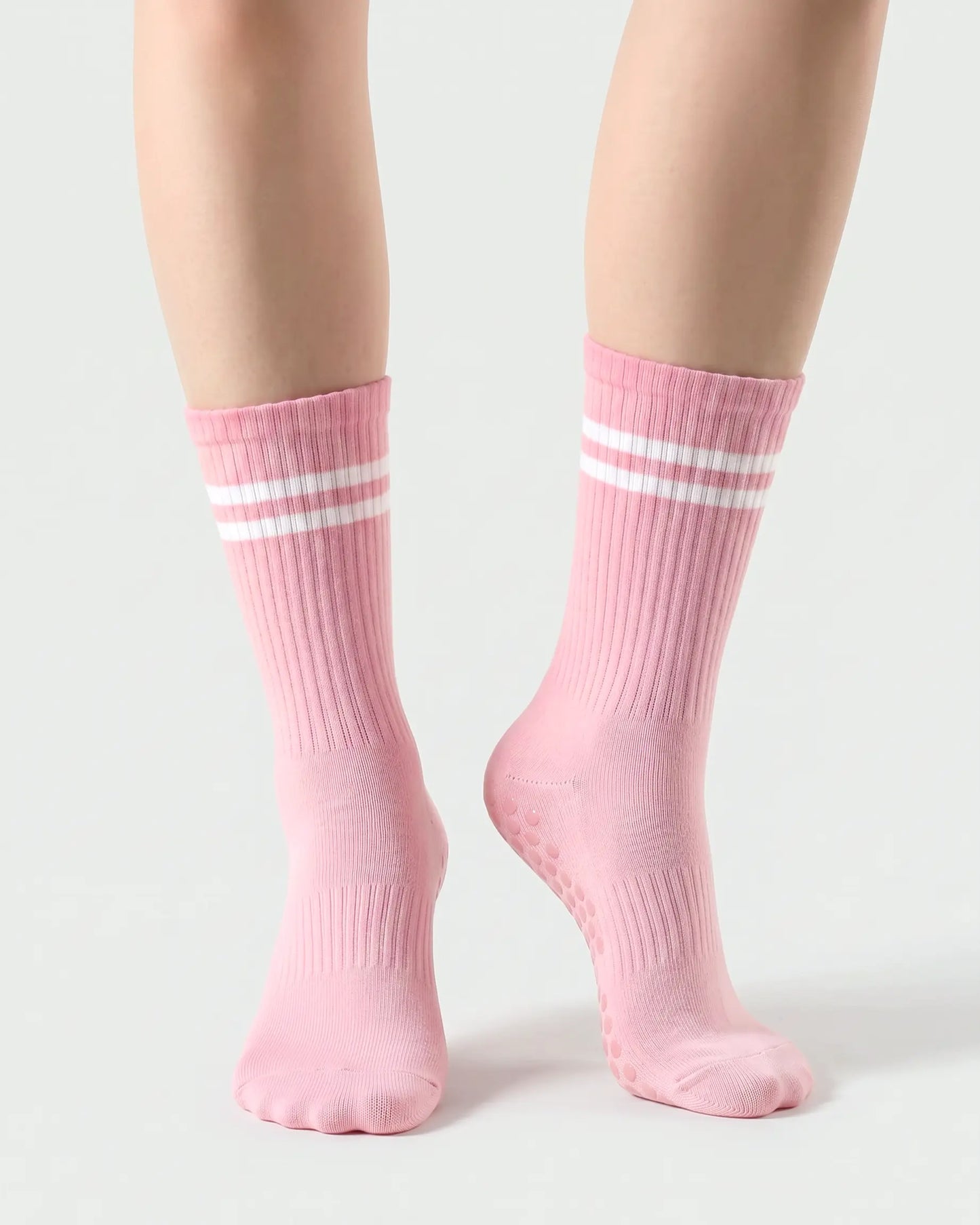 pink | 04 | Pink double-stripe crew grip socks front angled view showing ribbed texture, stripe detail, and crew height