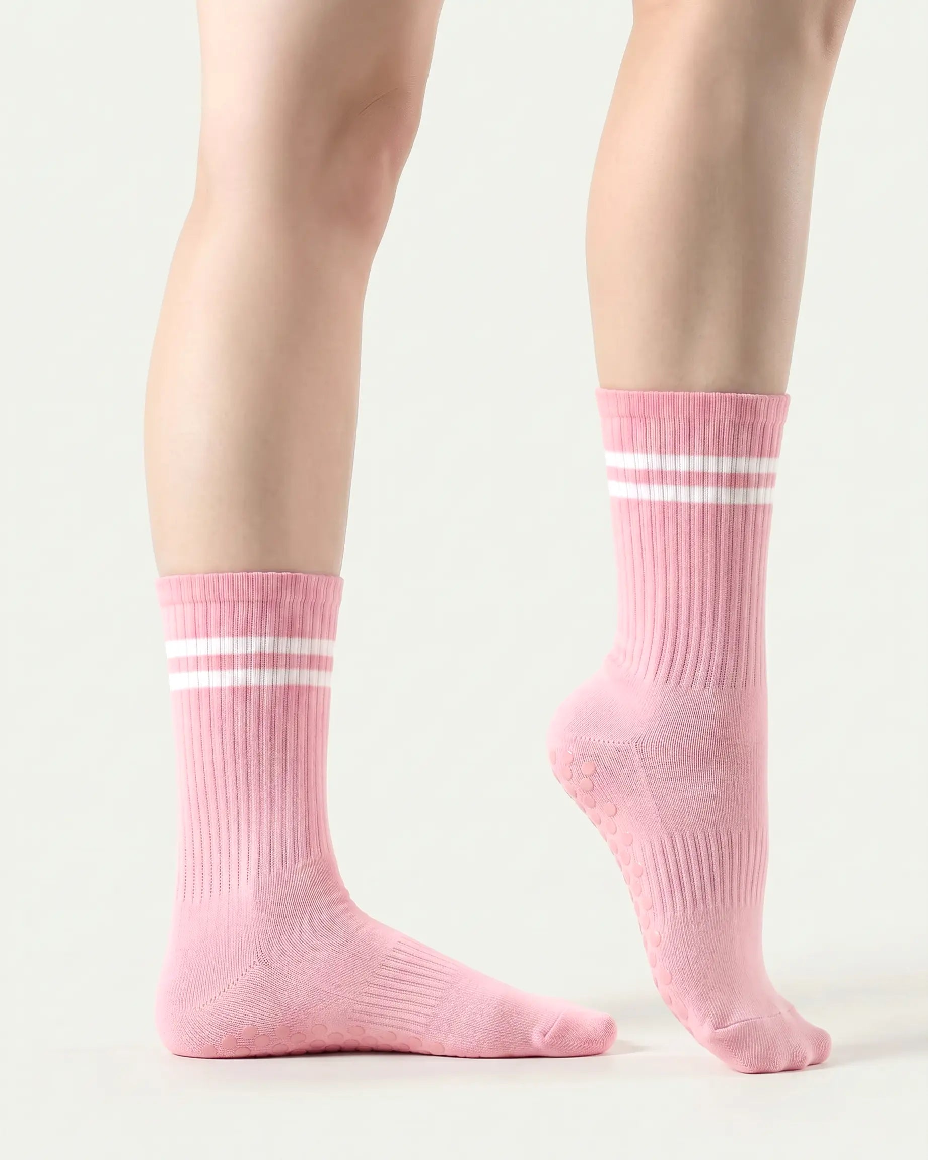 pink | 03 | Pink double-stripe crew grip socks side standing view showing clean silhouette, contrast stripe detail, and crew fit